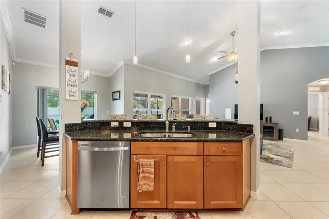 a kitchen with stainless steel appliances granite countertop a stove and a sink
