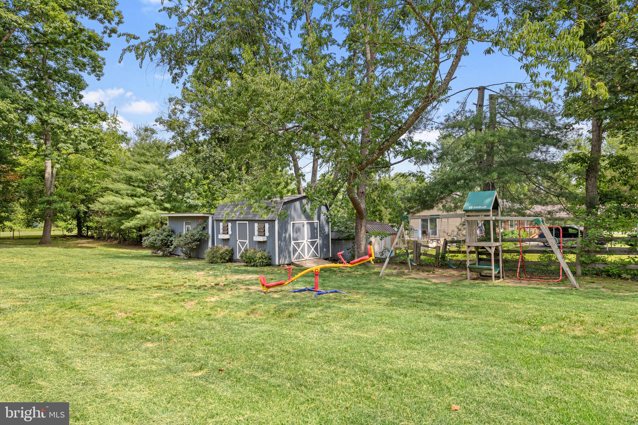 12237 Randle Lane Culpeper, VA 22701 - Photo 25 of 31 a backyard of a house with garden and outdoor seating