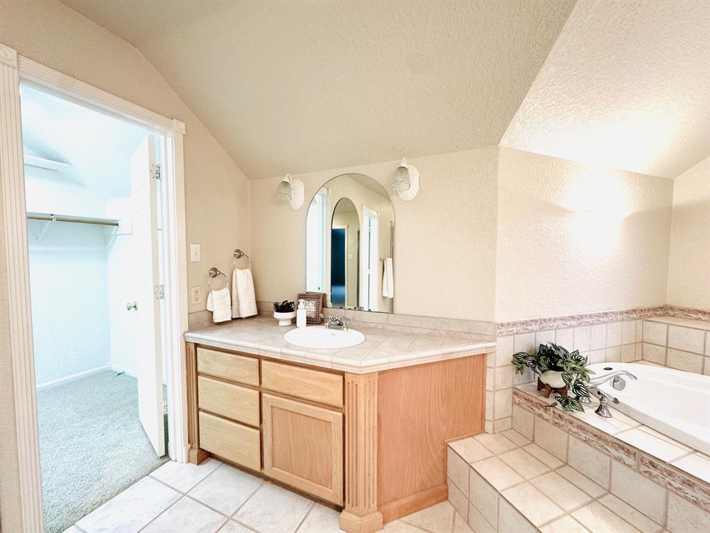 400 Indian Hills Road Gatesville, TX 76528 - Photo 20 of 38 a room with a sink and a mirror