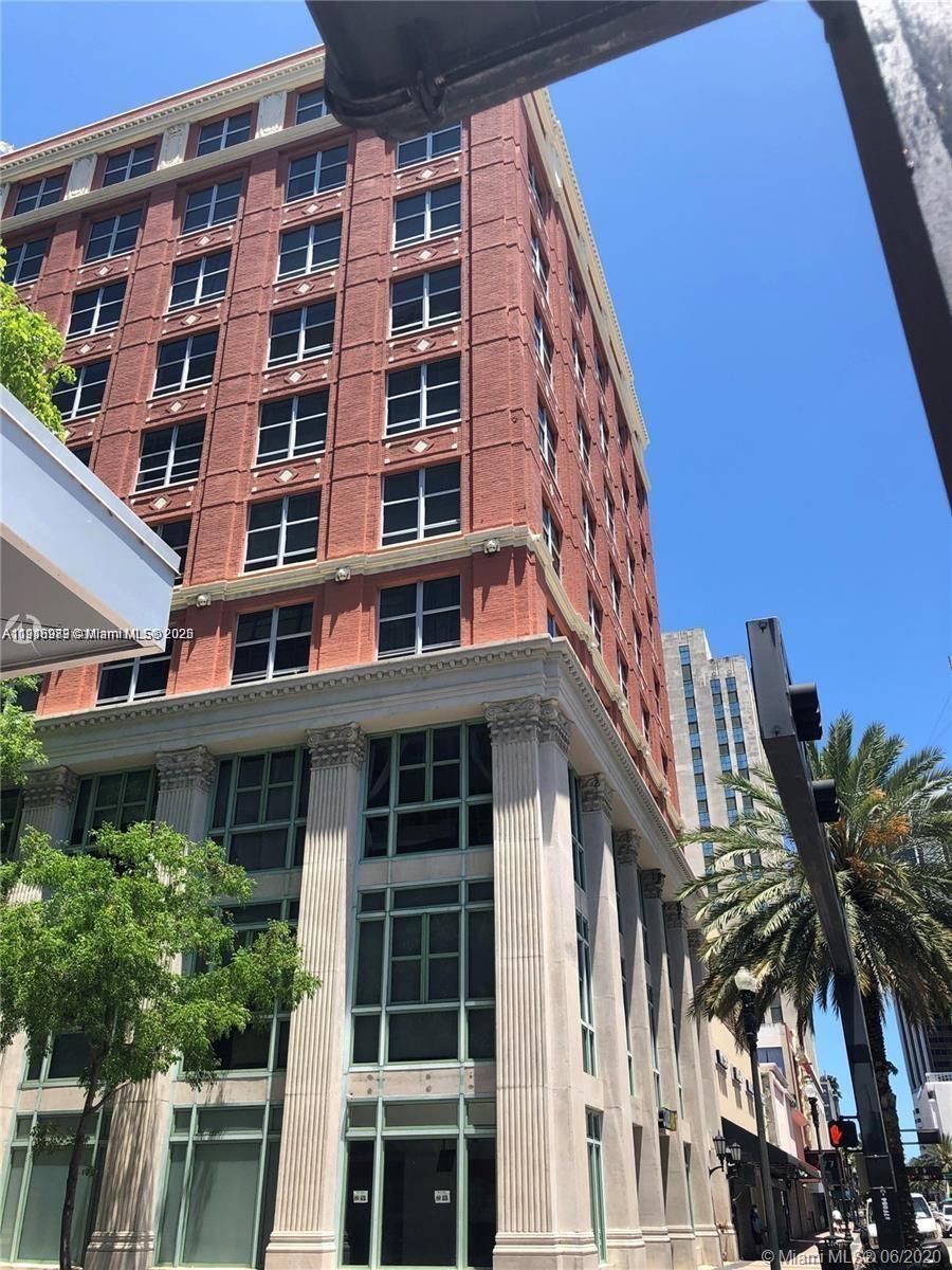 111 East Flagler Street, Unit 803 Miami, FL 33131 - Photo 13 of 16 a front view of a multi story building