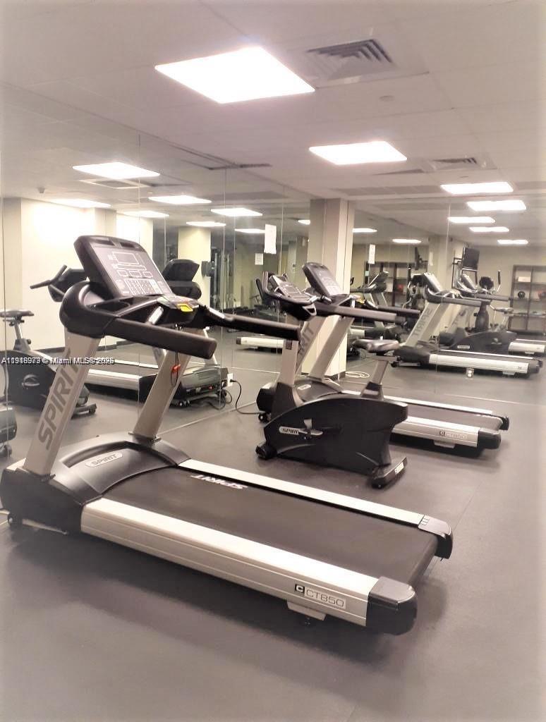 111 East Flagler Street, Unit 803 Miami, FL 33131 - Photo 15 of 16 a view of a room with gym equipment