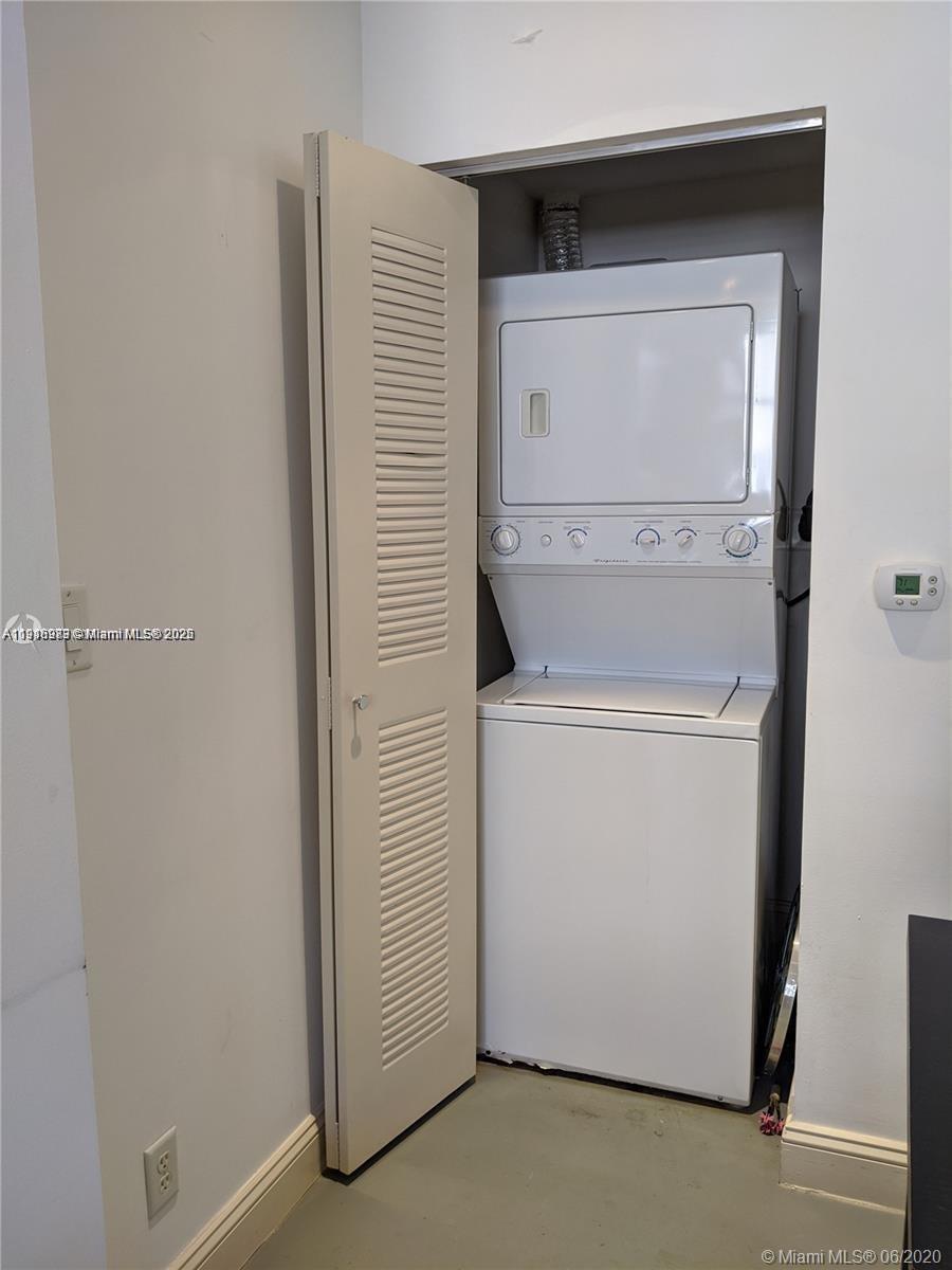 111 East Flagler Street, Unit 803 Miami, FL 33131 - Photo 16 of 16 a utility room with dryer and washer