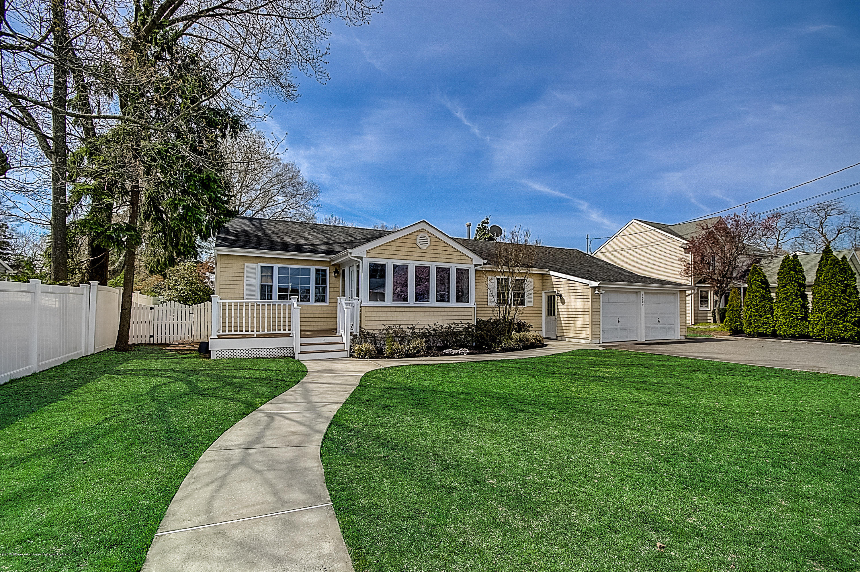 2302 Oak Tree Road Point Pleasant, NJ 08742 - Photo 1 of 48 a front view of a house with a yard