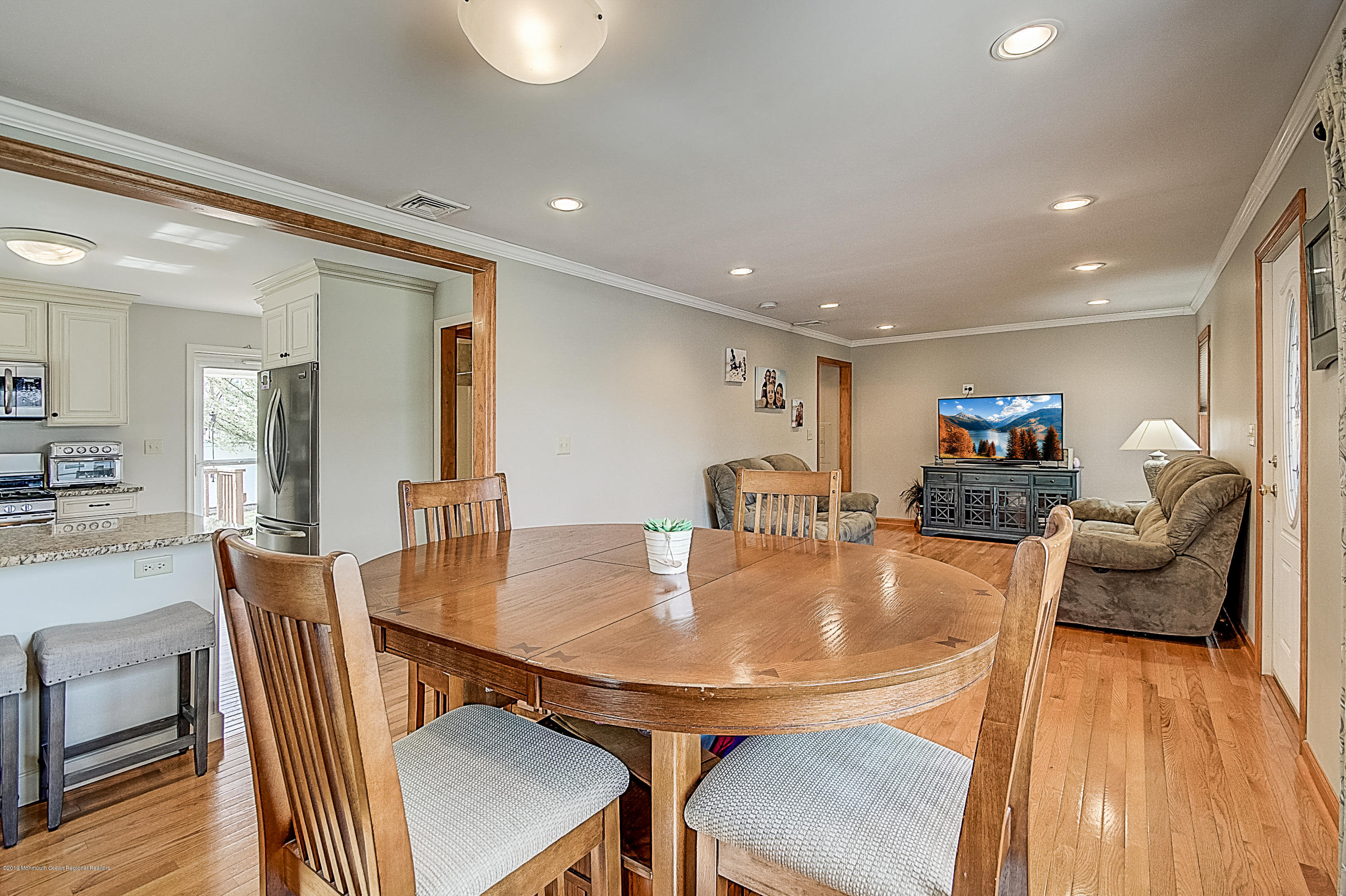 2302 Oak Tree Road Point Pleasant, NJ 08742 - Photo 11 of 48 a dining room with furniture and wooden floor