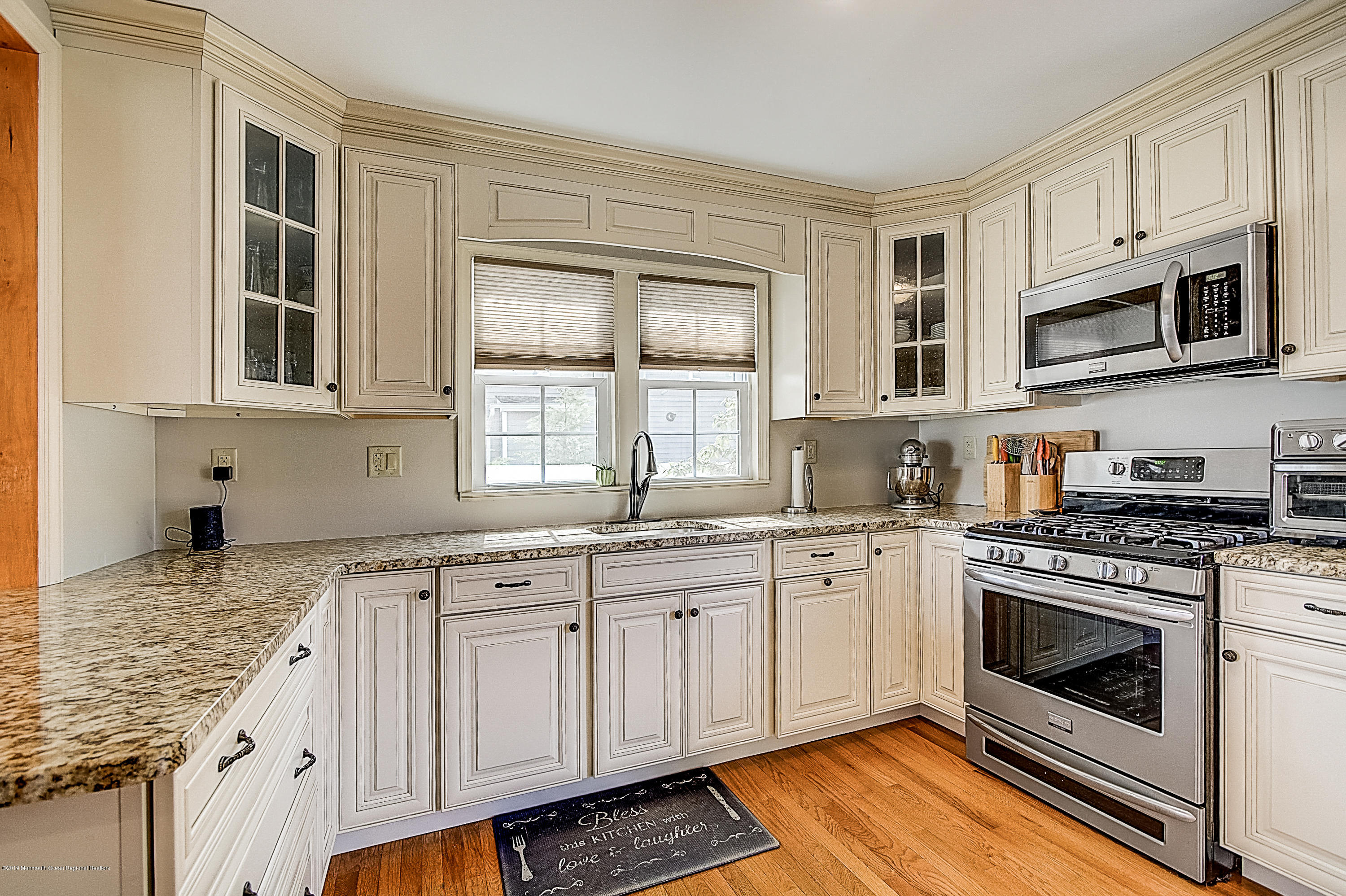 2302 Oak Tree Road Point Pleasant, NJ 08742 - Photo 13 of 48 a kitchen with stainless steel appliances granite countertop a stove and cabinets