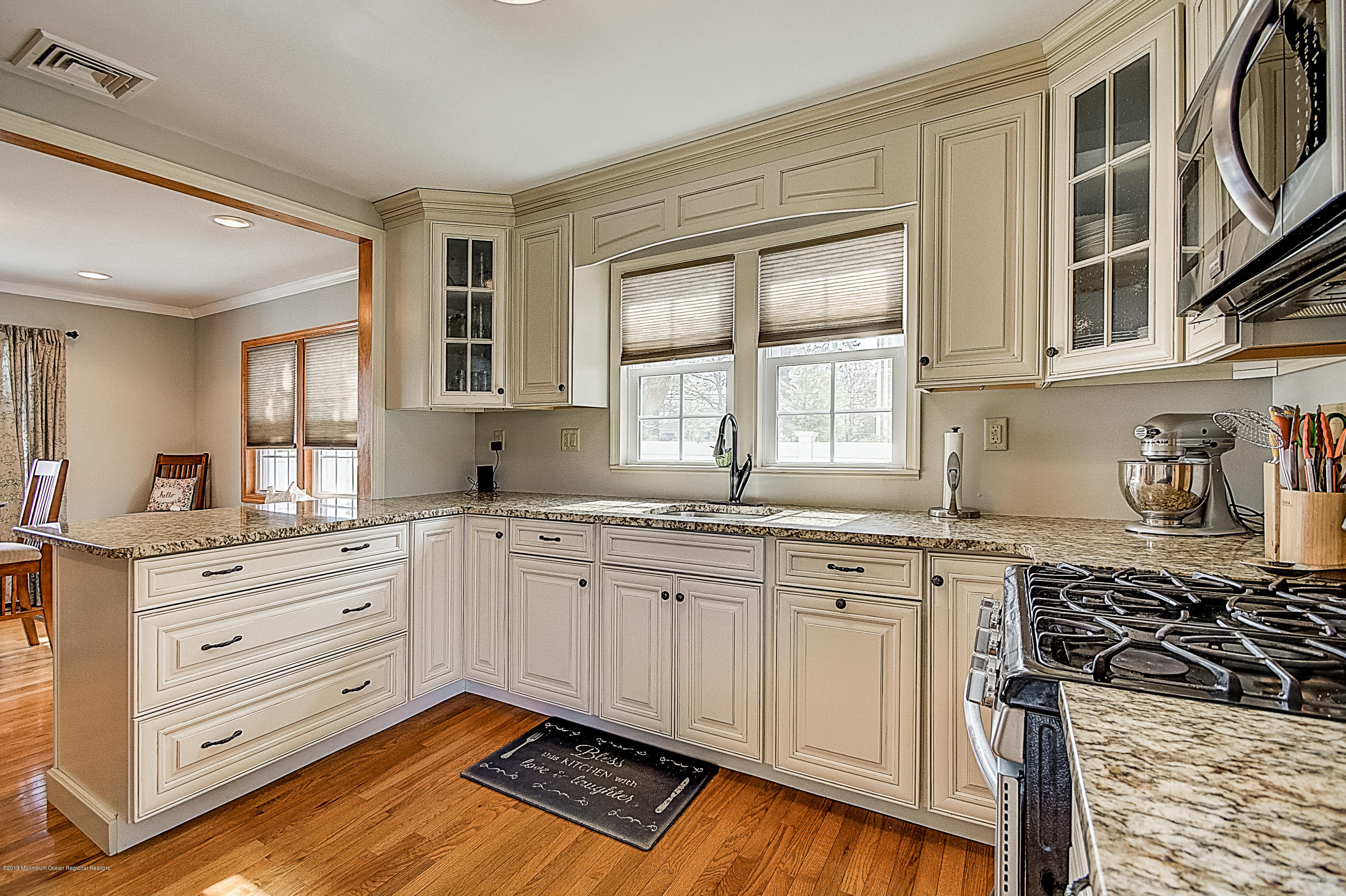2302 Oak Tree Road Point Pleasant, NJ 08742 - Photo 14 of 48 a kitchen with granite countertop a sink stove and cabinets