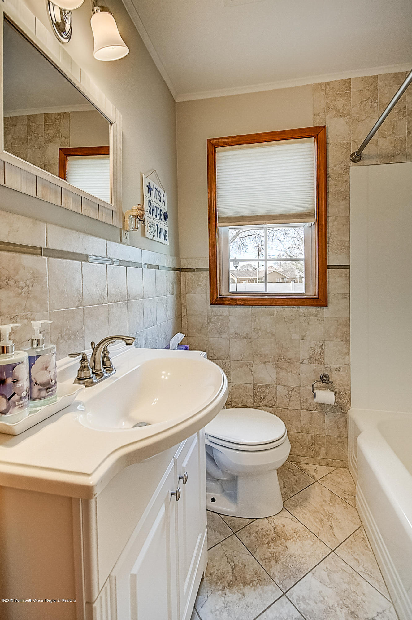 2302 Oak Tree Road Point Pleasant, NJ 08742 - Photo 18 of 48 a bathroom with a sink toilet and mirror