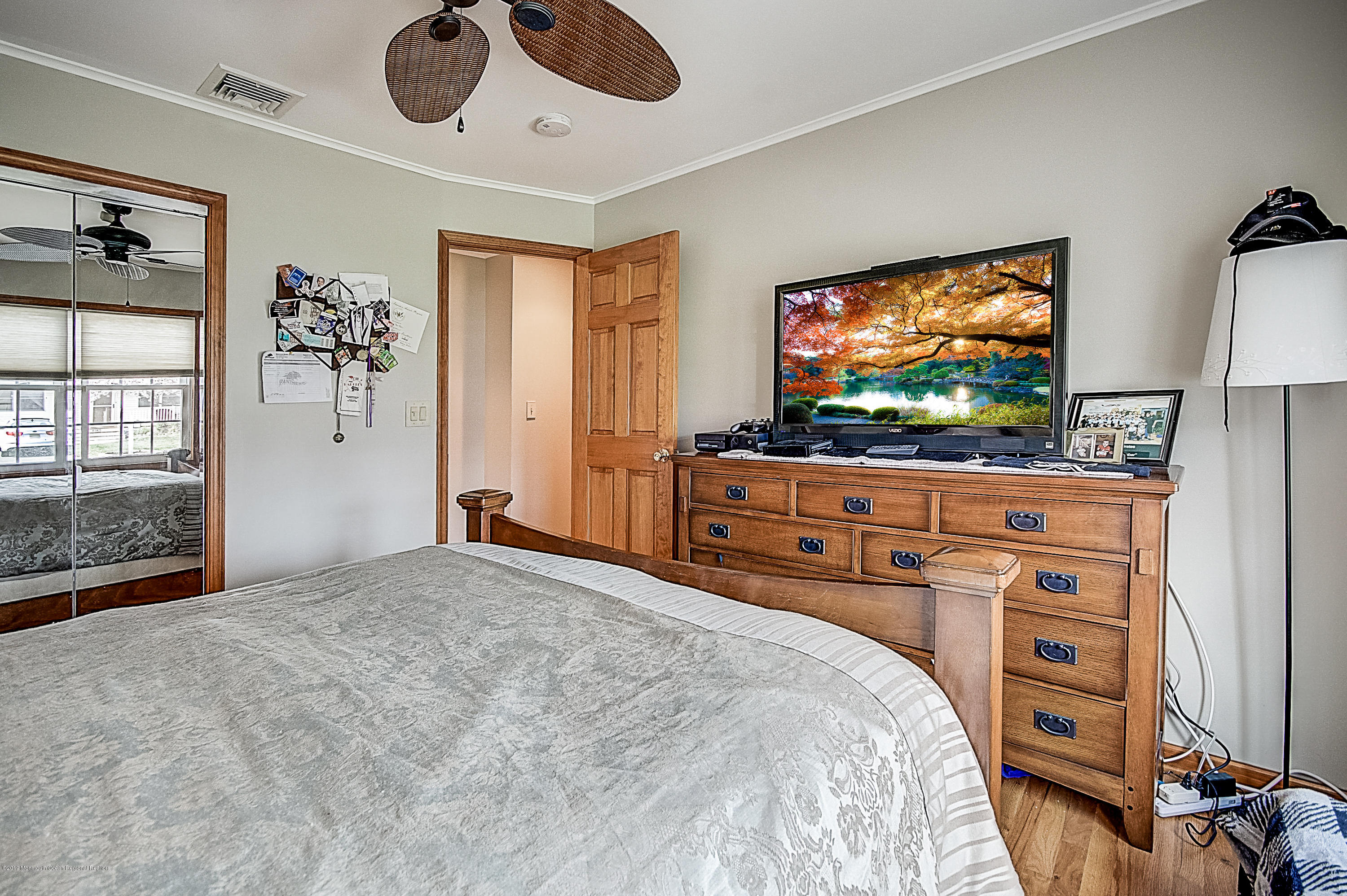 2302 Oak Tree Road Point Pleasant, NJ 08742 - Photo 35 of 48 a bedroom with furniture and flat screen tv