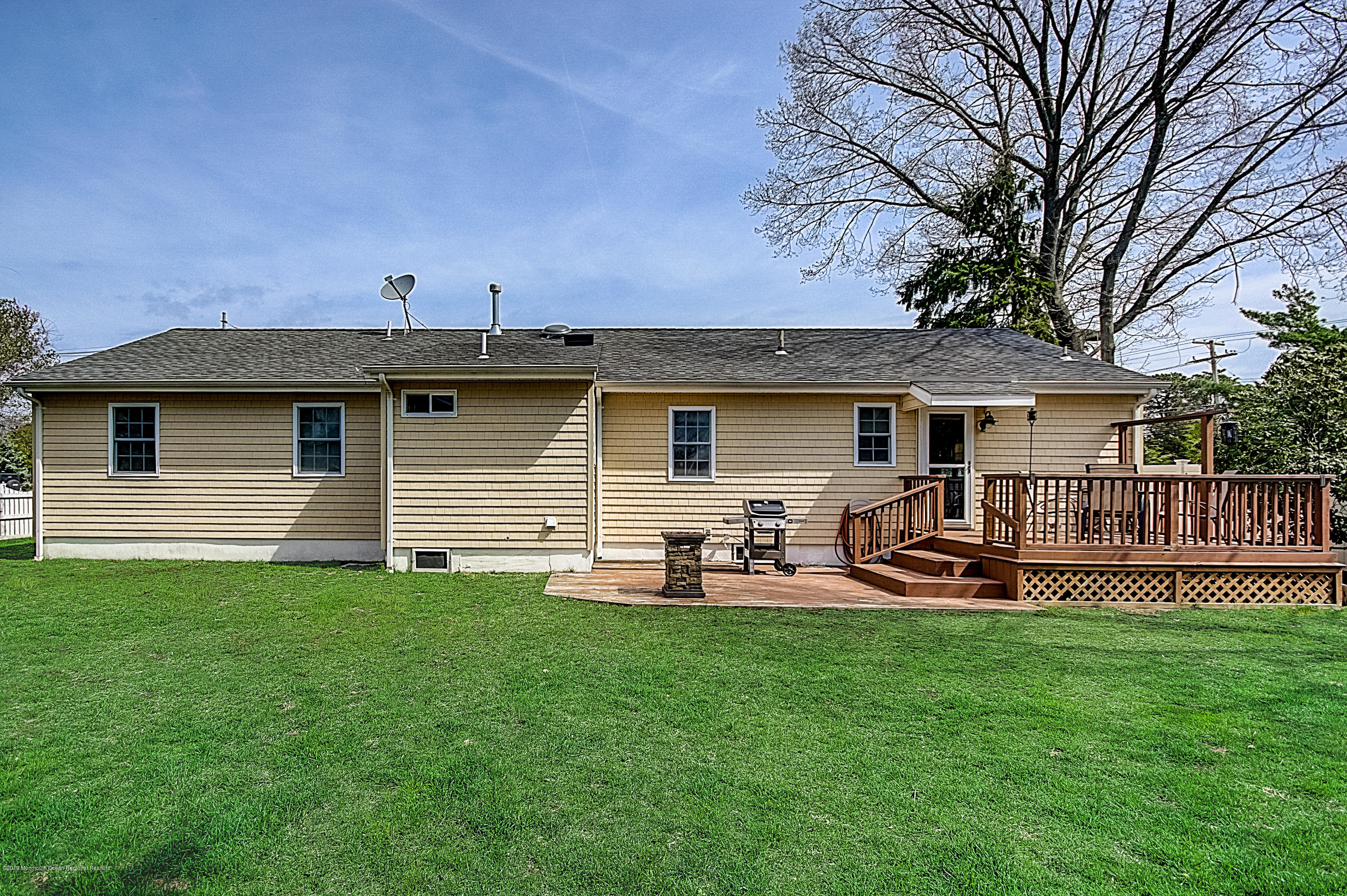 2302 Oak Tree Road Point Pleasant, NJ 08742 - Photo 42 of 48 a front view of house with yard and seating area