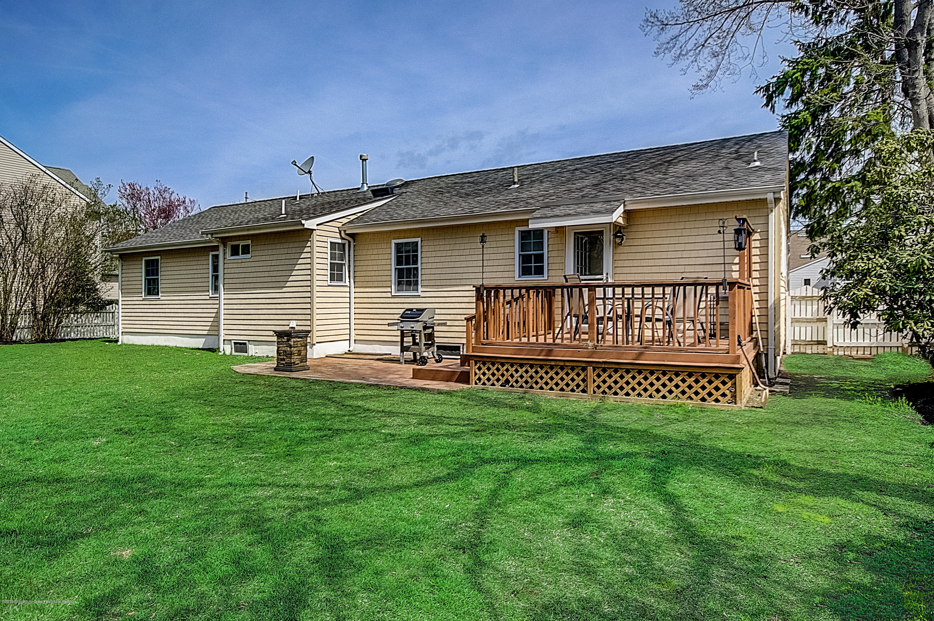 2302 Oak Tree Road Point Pleasant, NJ 08742 - Photo 43 of 48 a view of a house with a yard