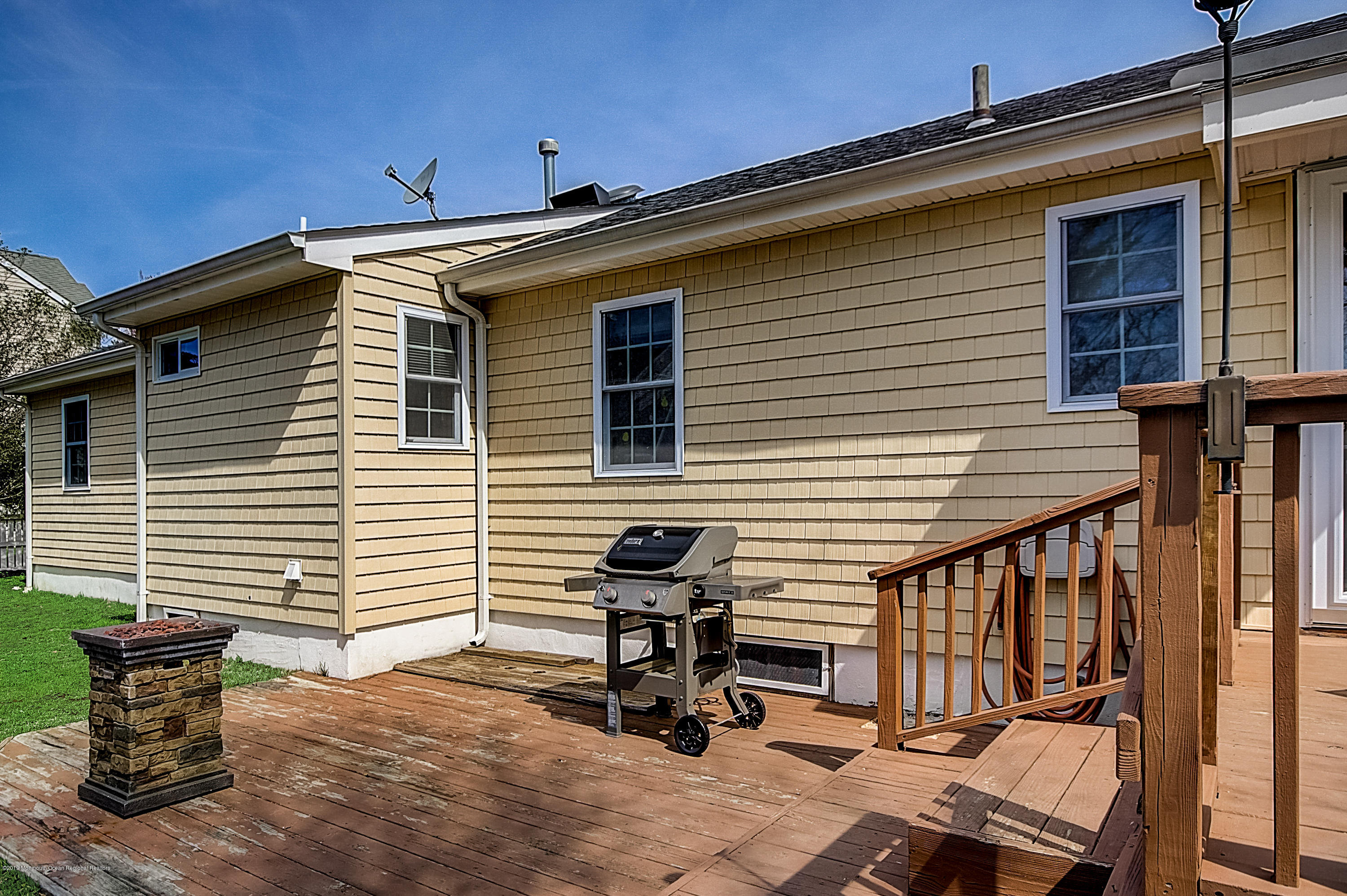2302 Oak Tree Road Point Pleasant, NJ 08742 - Photo 45 of 48 a view of a patio with a table and chairs