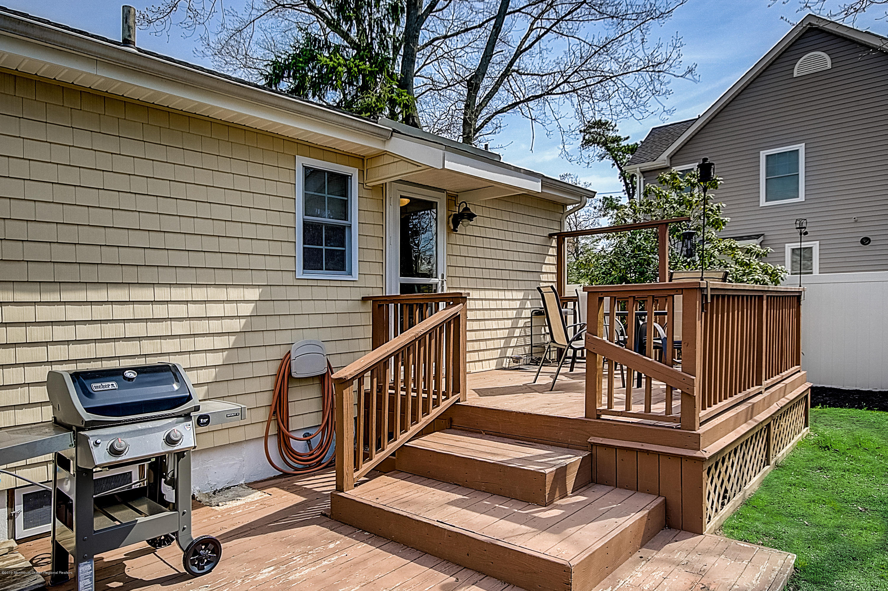 2302 Oak Tree Road Point Pleasant, NJ 08742 - Photo 46 of 48 a view of backyard with deck and a garden