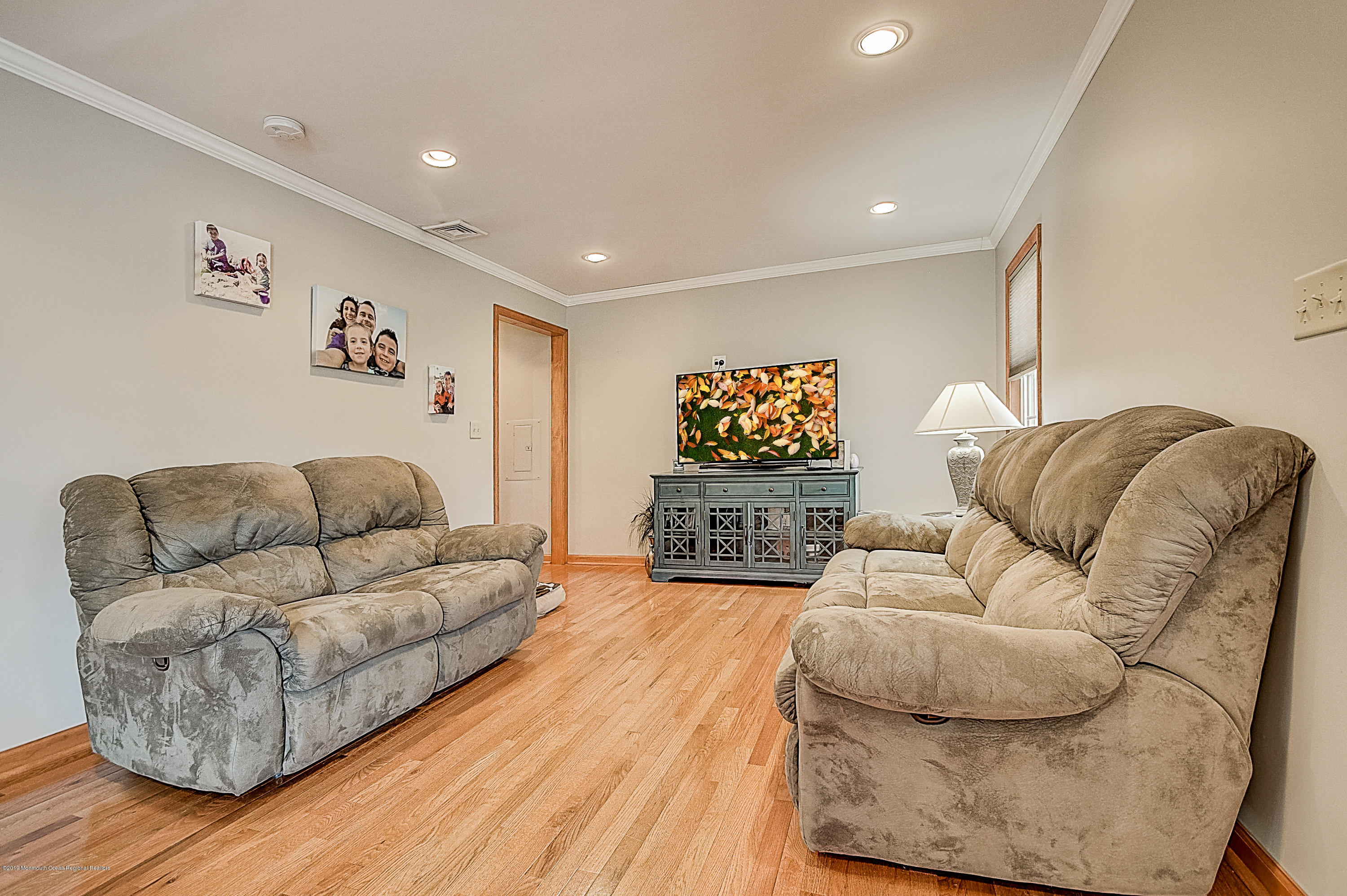 2302 Oak Tree Road Point Pleasant, NJ 08742 - Photo 7 of 48 a living room with furniture and a wooden floor