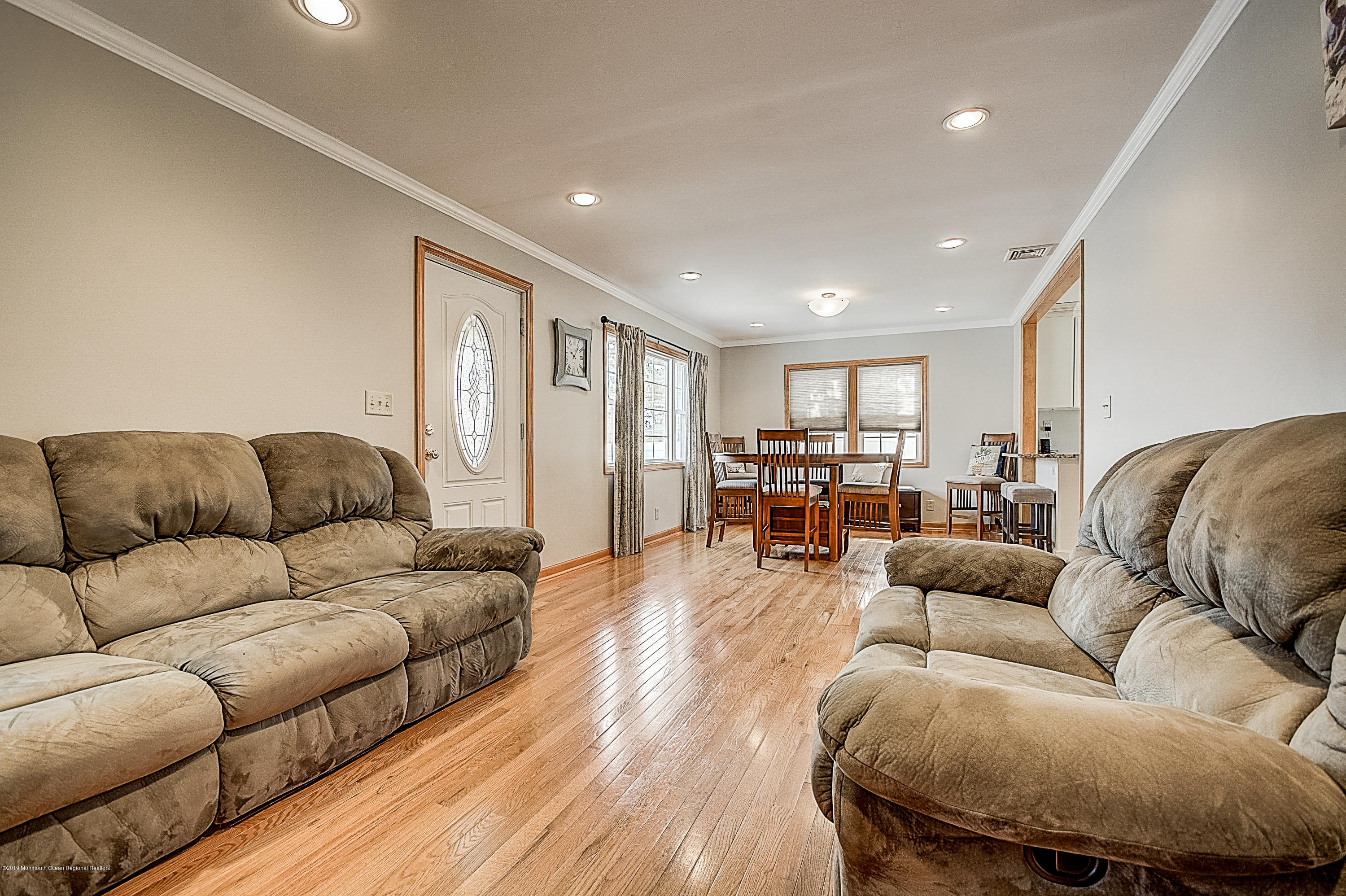 2302 Oak Tree Road Point Pleasant, NJ 08742 - Photo 8 of 48 a living room with furniture and wooden floors