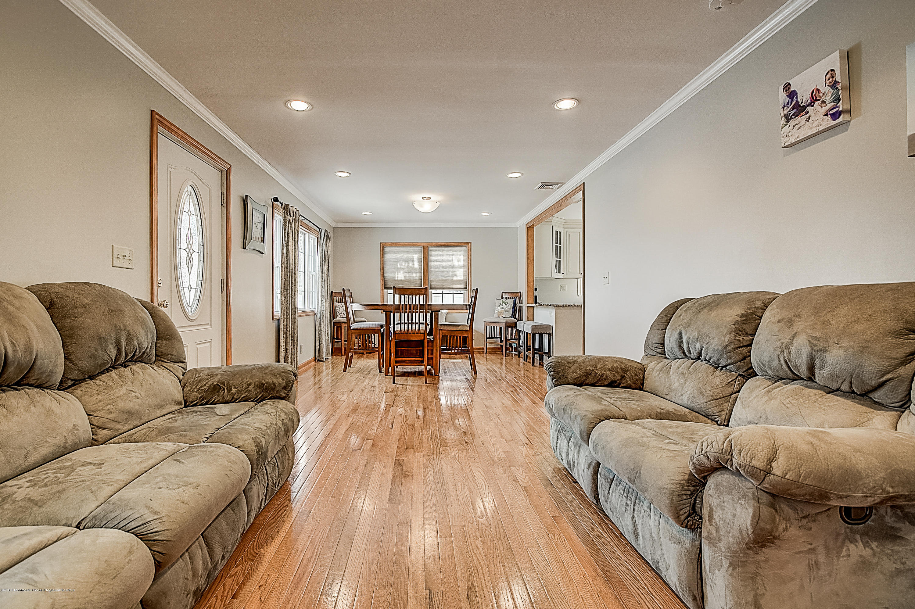 2302 Oak Tree Road Point Pleasant, NJ 08742 - Photo 9 of 48 a living room with furniture and a couch