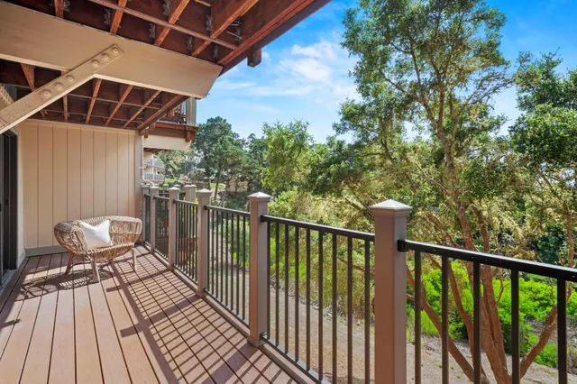 a view of a balcony with wooden floor