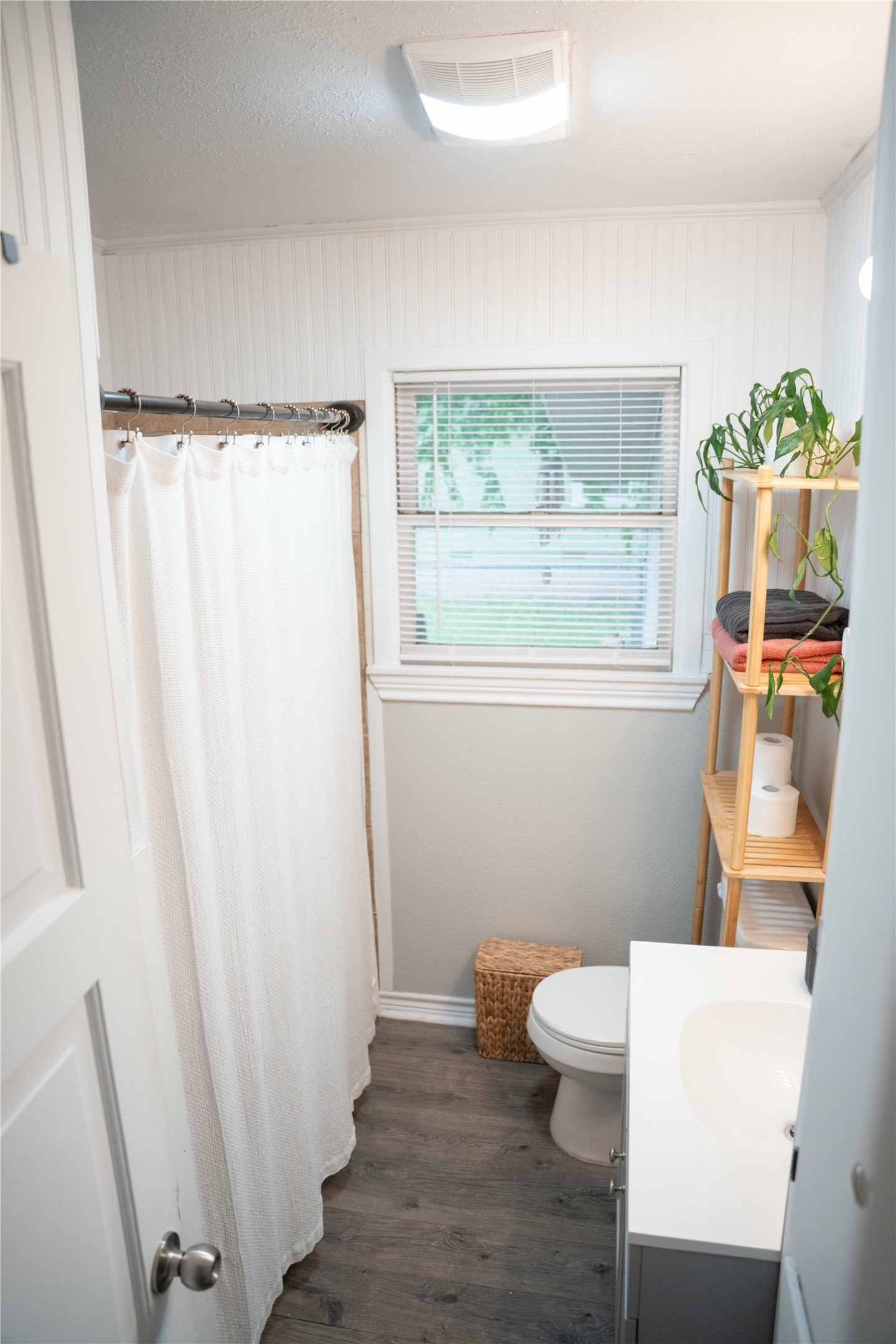 1120 Nix Road Lampasas, TX 76550 - Photo 13 of 31 a bathroom with a sink a toilet a window and shower
