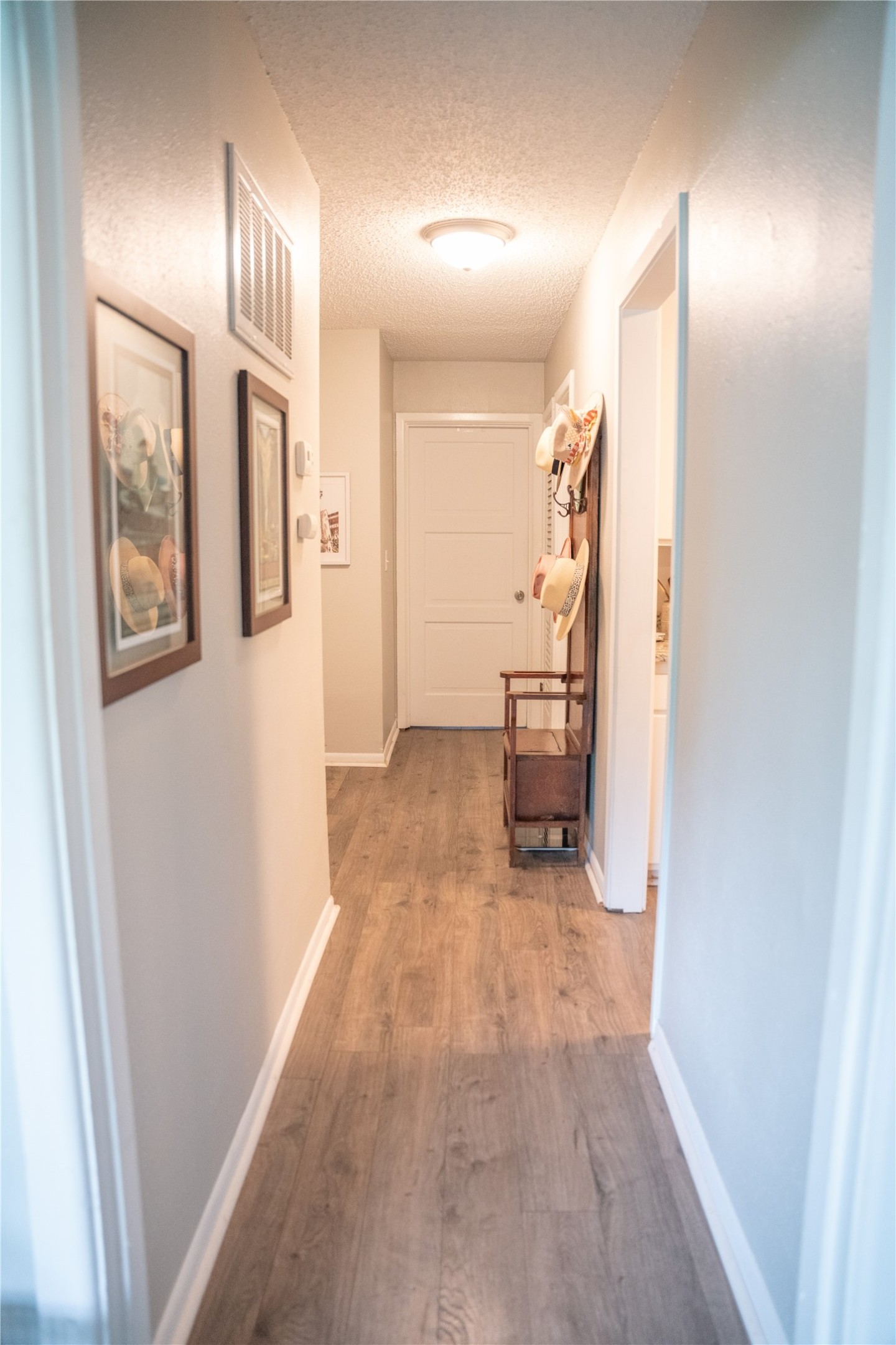 1120 Nix Road Lampasas, TX 76550 - Photo 22 of 31 a view of a hallway with wooden floor and furniture