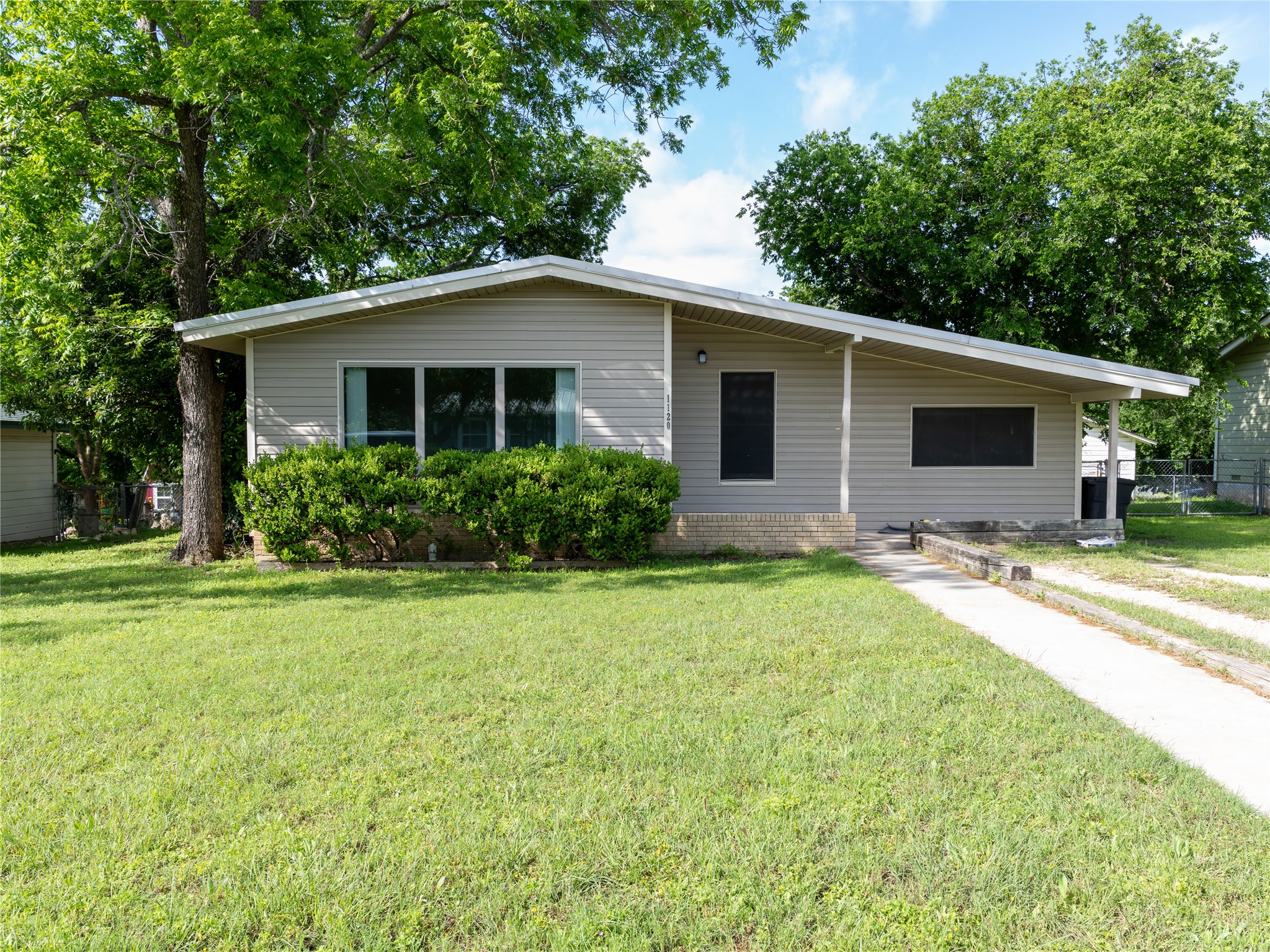 1120 Nix Road Lampasas, TX 76550 - Photo 3 of 31 a view of a house with backyard and garden