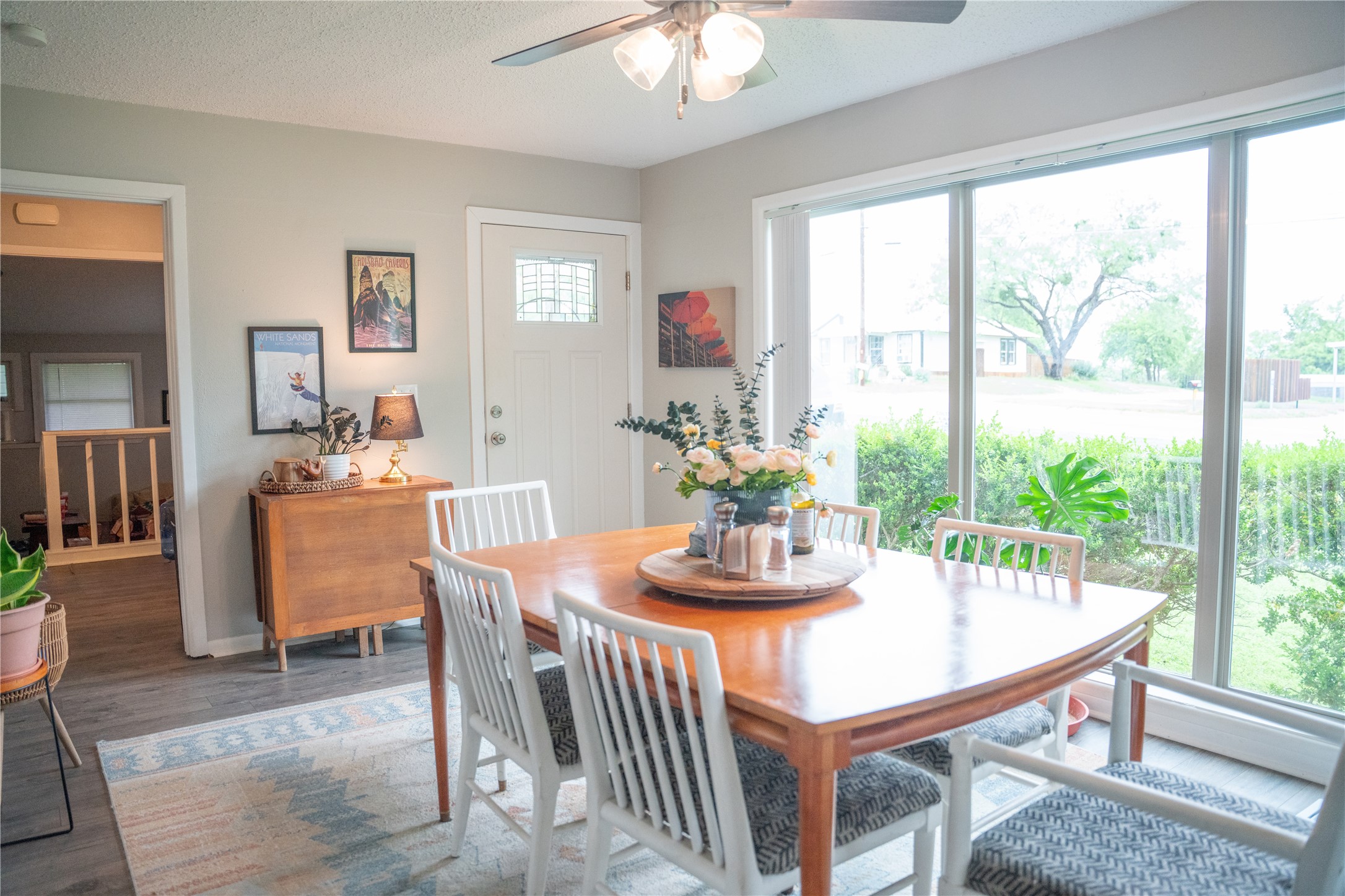 1120 Nix Road Lampasas, TX 76550 - Photo 5 of 31 a dining room with furniture a large window and wooden floor