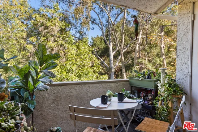 a table and chairs in a patio