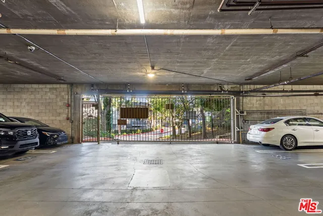 a view of parking garage with cars