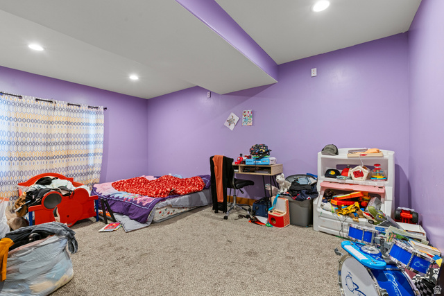 4557 North Ranch Road East Tooele, UT 84074 - Photo 28 of 43 Recessed lighting illuminates the carpeted flooring and purple walls