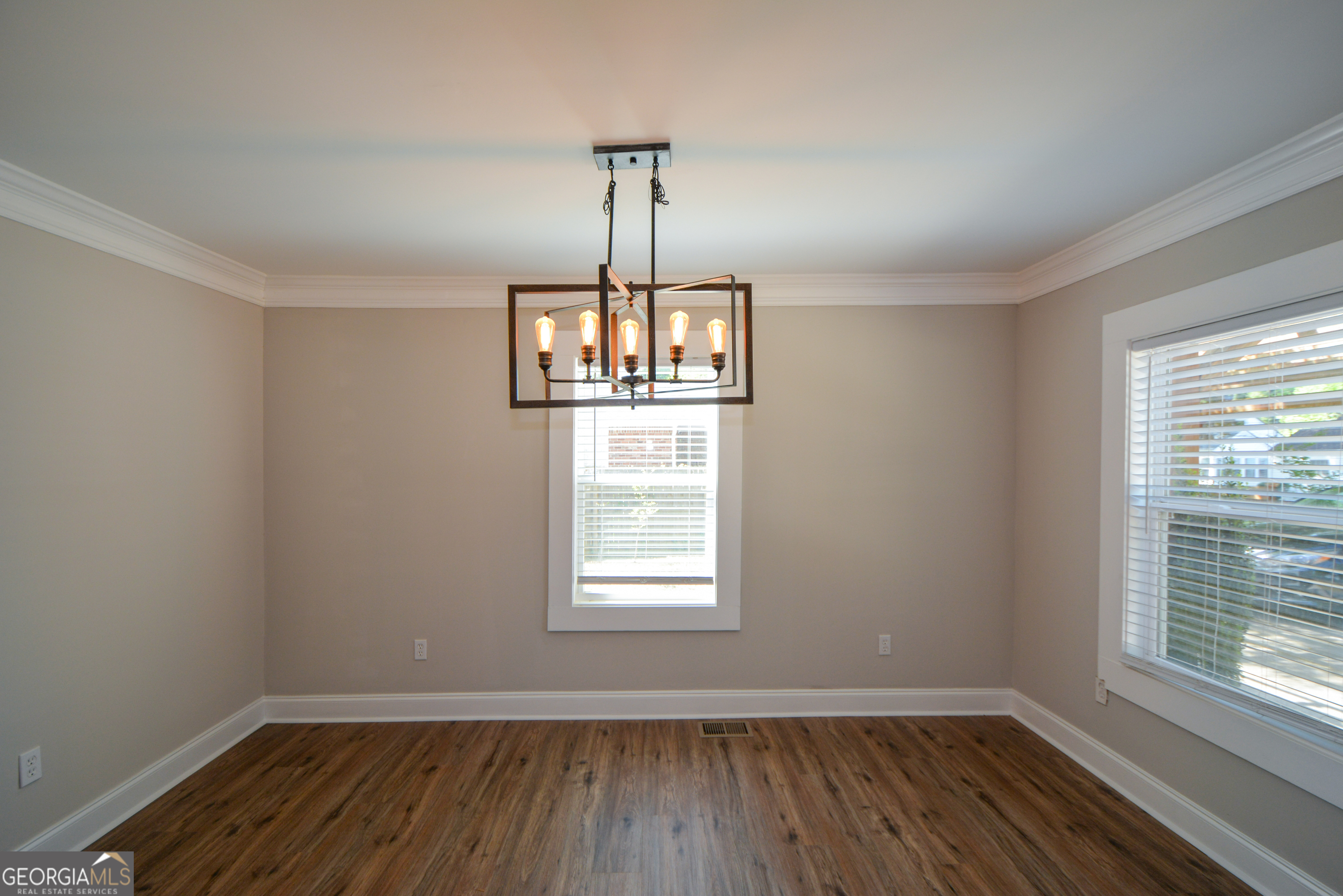 3164 Harris Drive East Point, GA 30344 - Photo 13 of 40 a view of an empty room with wooden floor and a window