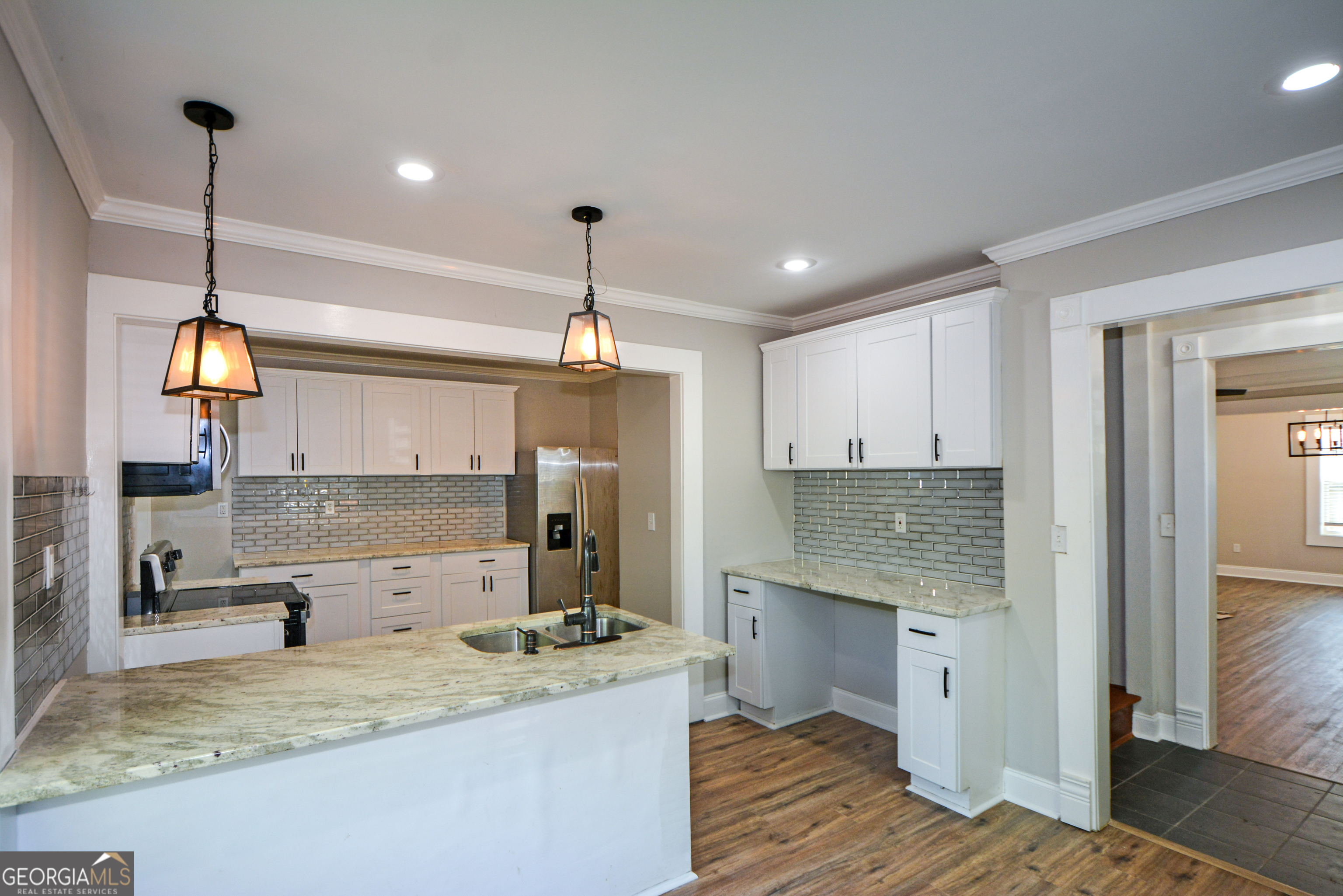3164 Harris Drive East Point, GA 30344 - Photo 14 of 40 a kitchen with stainless steel appliances granite countertop a sink a stove and a refrigerator
