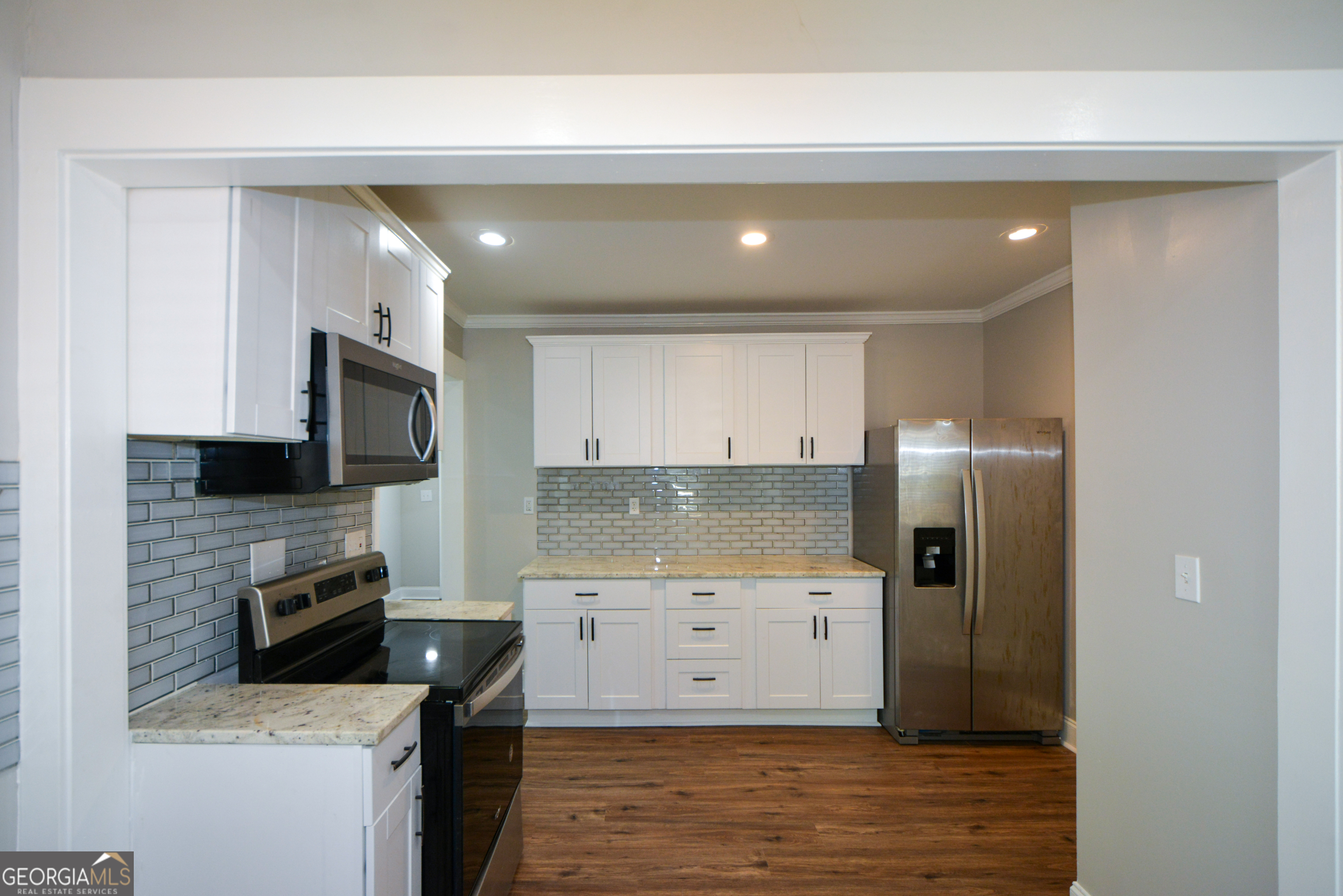 3164 Harris Drive East Point, GA 30344 - Photo 15 of 40 a kitchen with a refrigerator and a stove top oven