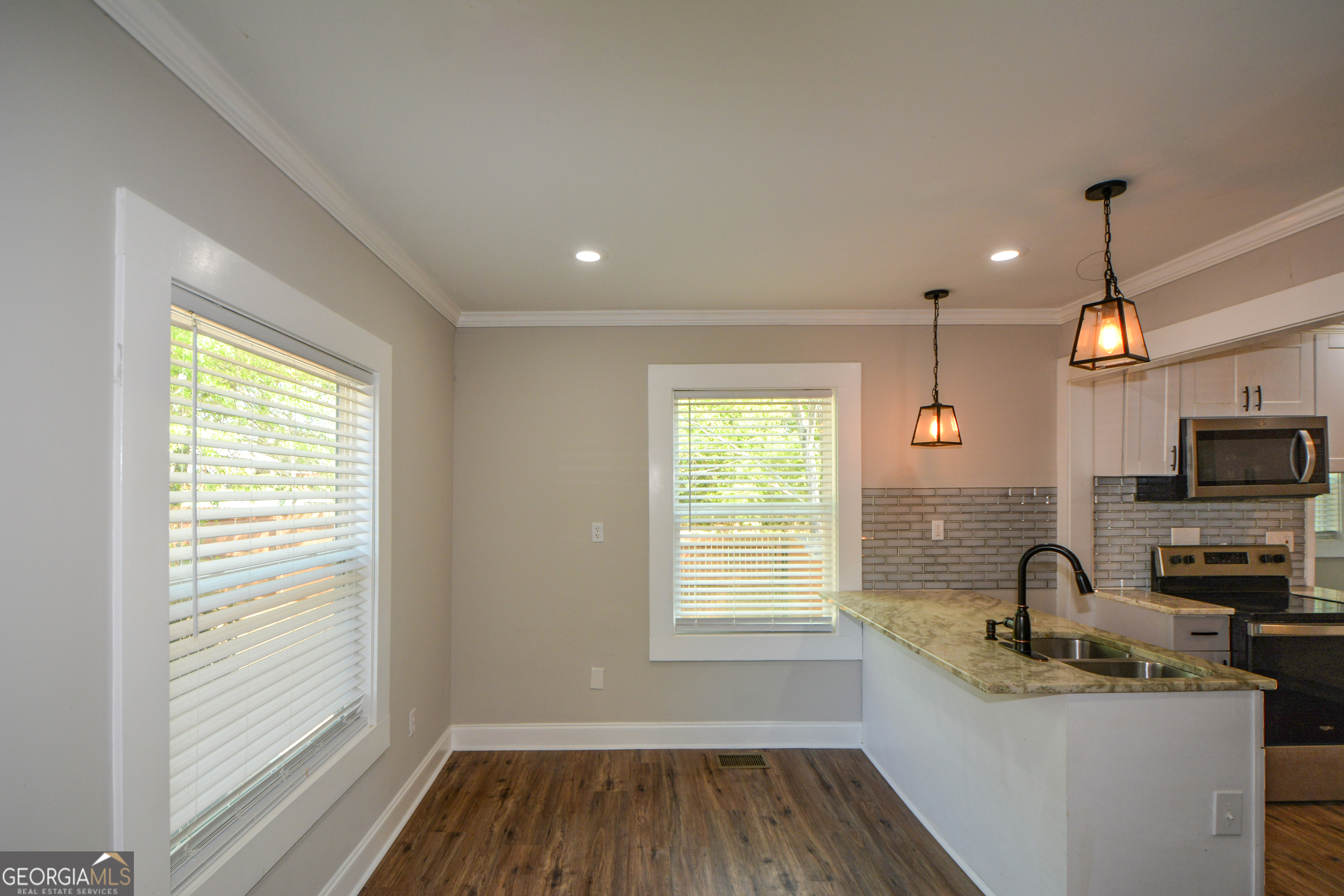 3164 Harris Drive East Point, GA 30344 - Photo 20 of 40 a kitchen with granite countertop a sink and a stove top oven