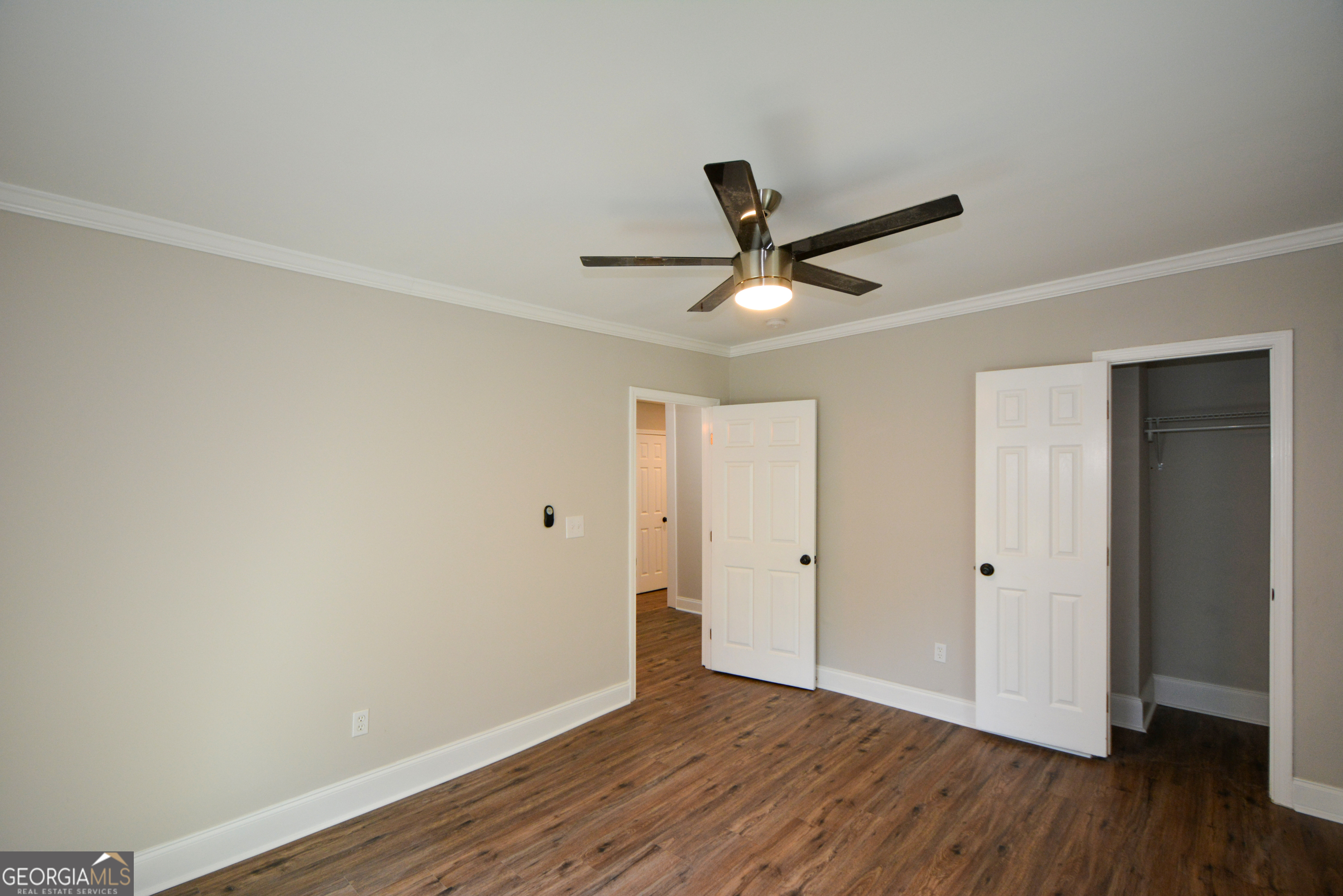 3164 Harris Drive East Point, GA 30344 - Photo 26 of 40 a view of a big room with wooden floor and windows