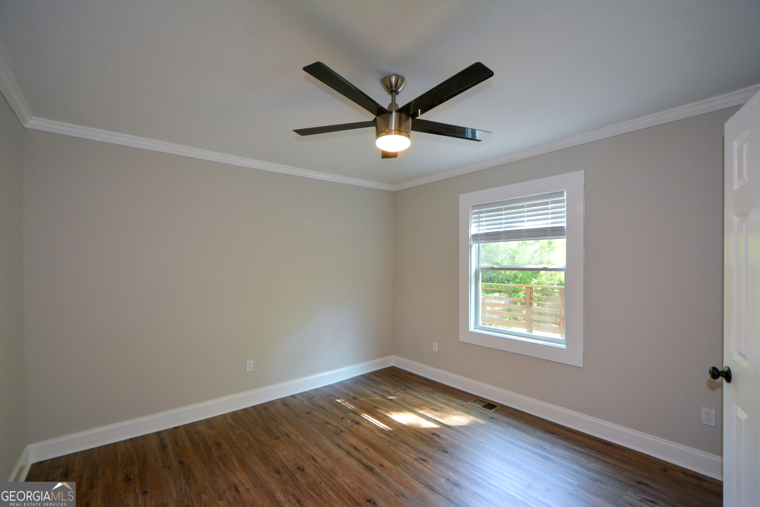 3164 Harris Drive East Point, GA 30344 - Photo 28 of 40 a view of empty room with wooden floor and fan