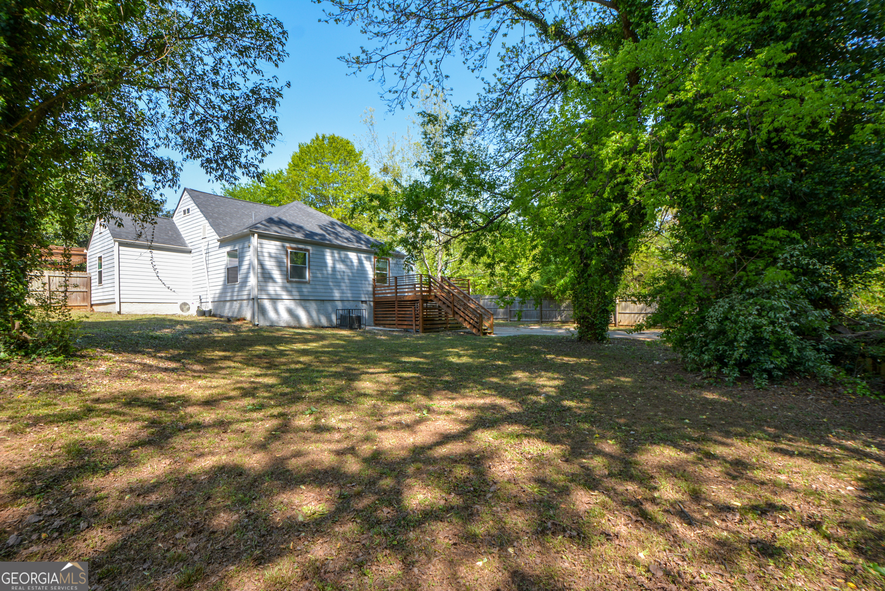 3164 Harris Drive East Point, GA 30344 - Photo 38 of 40 a view of a yard in front of a house with large tree