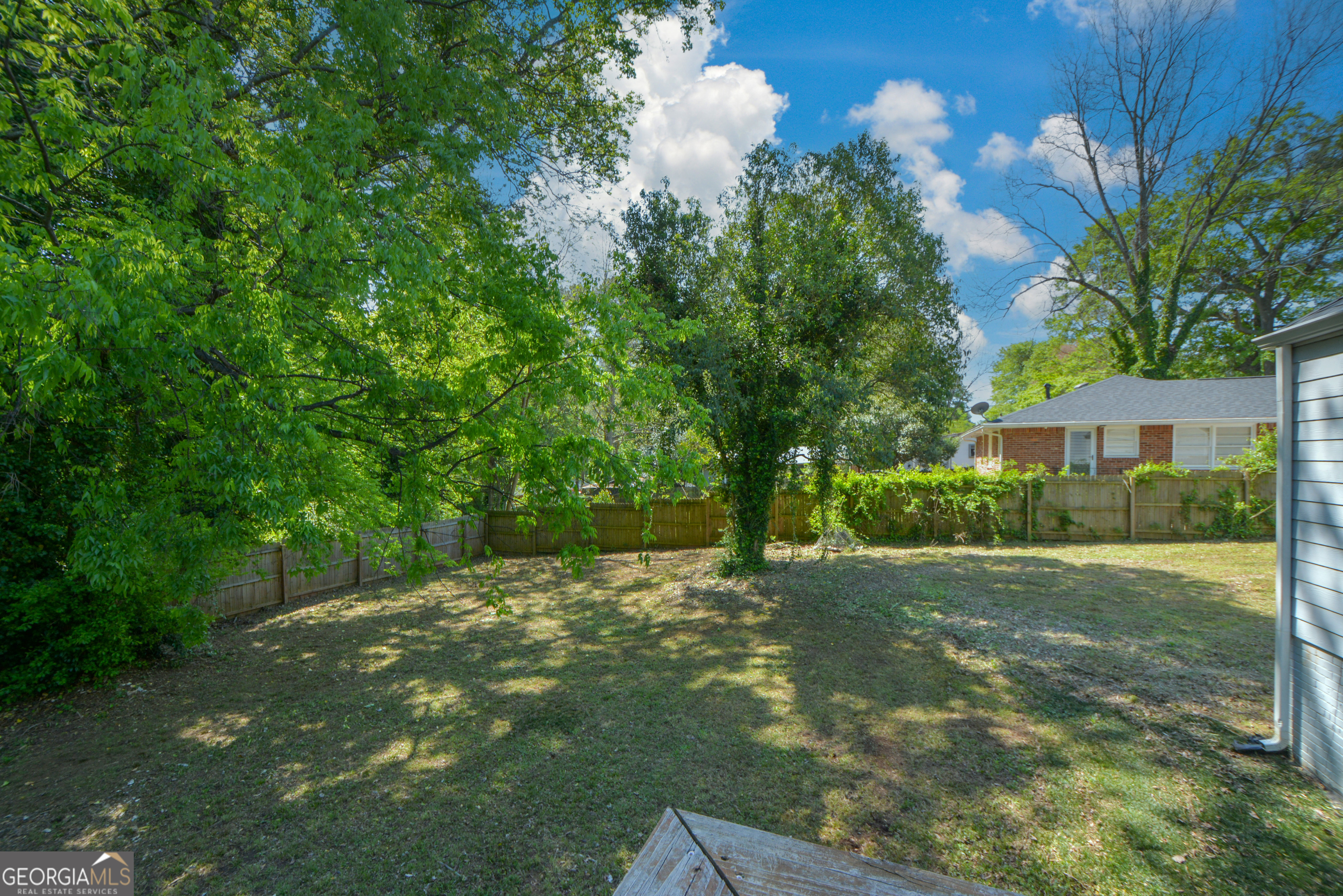 3164 Harris Drive East Point, GA 30344 - Photo 39 of 40 a backyard of a house with lots of green space