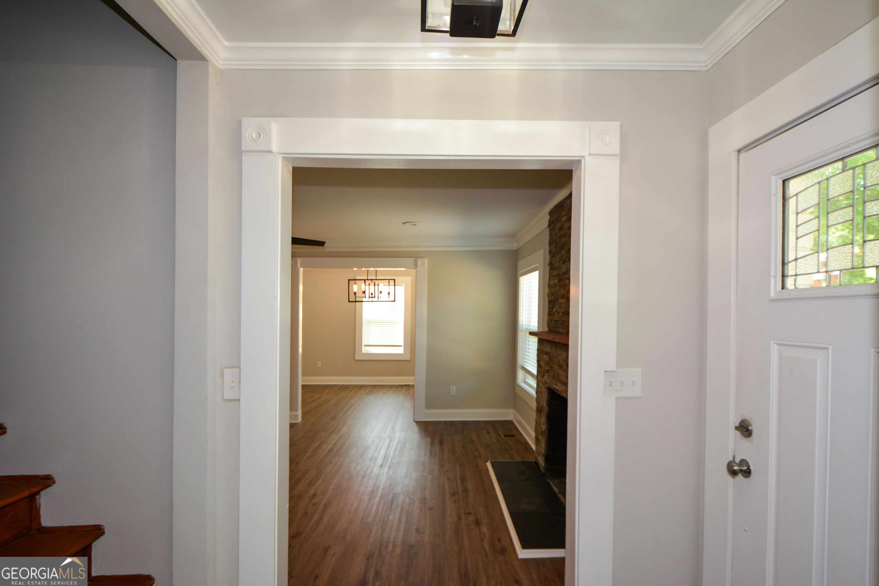 3164 Harris Drive East Point, GA 30344 - Photo 8 of 40 a view of a hallway with wooden floor and a living room
