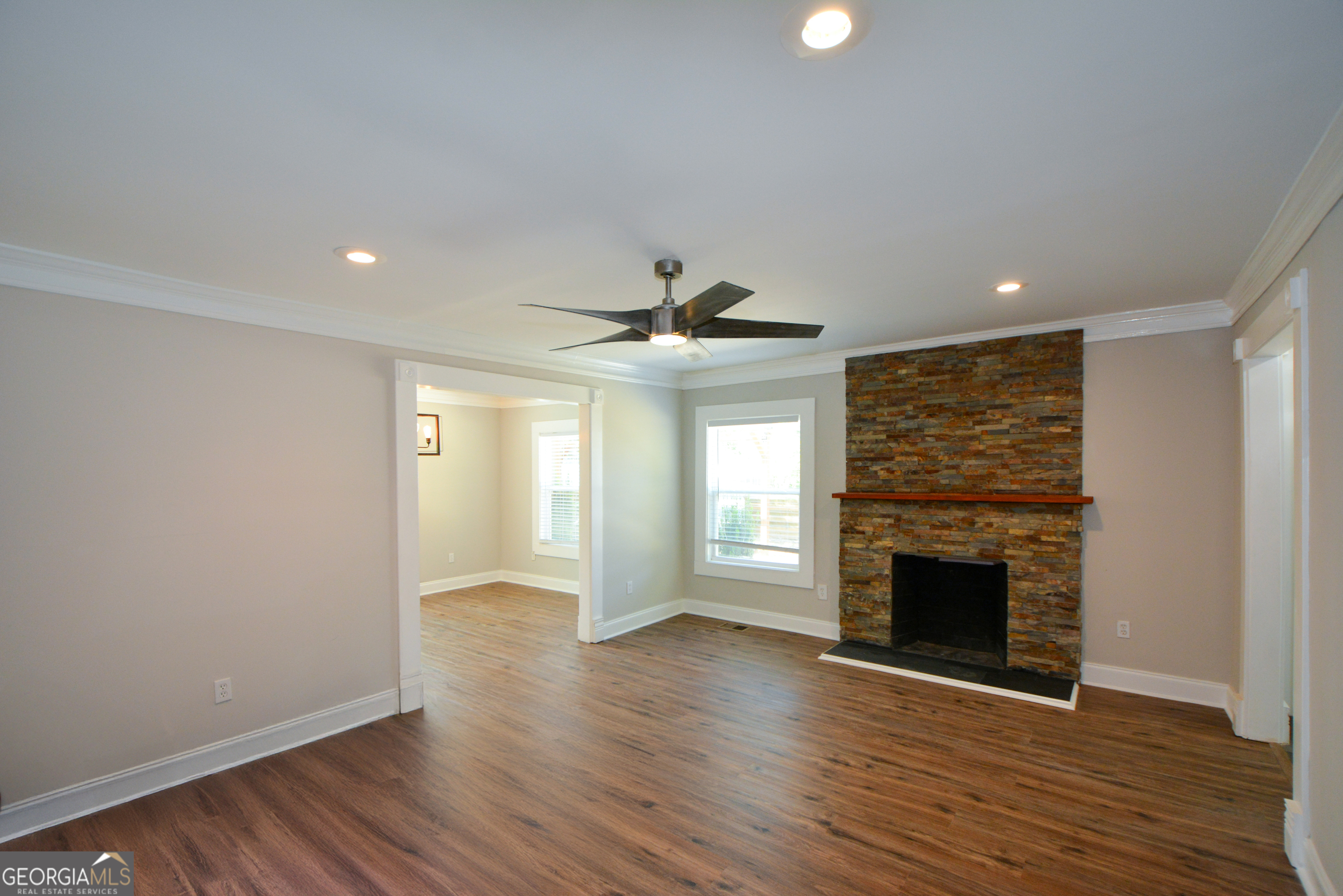 3164 Harris Drive East Point, GA 30344 - Photo 9 of 40 a view of an empty room with wooden floor fireplace and a window