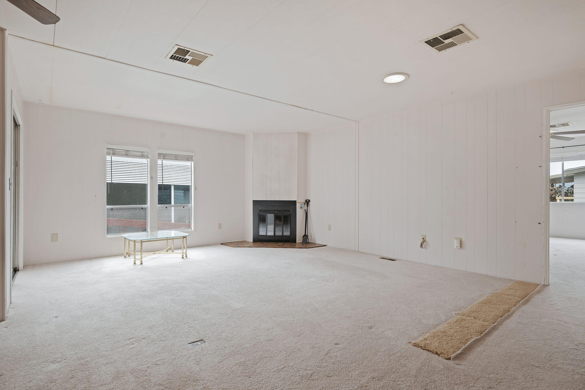 340 Old Mill Road, Unit 127 Santa Barbara, CA 93110 - Photo 14 of 33 an empty room with windows and fireplace