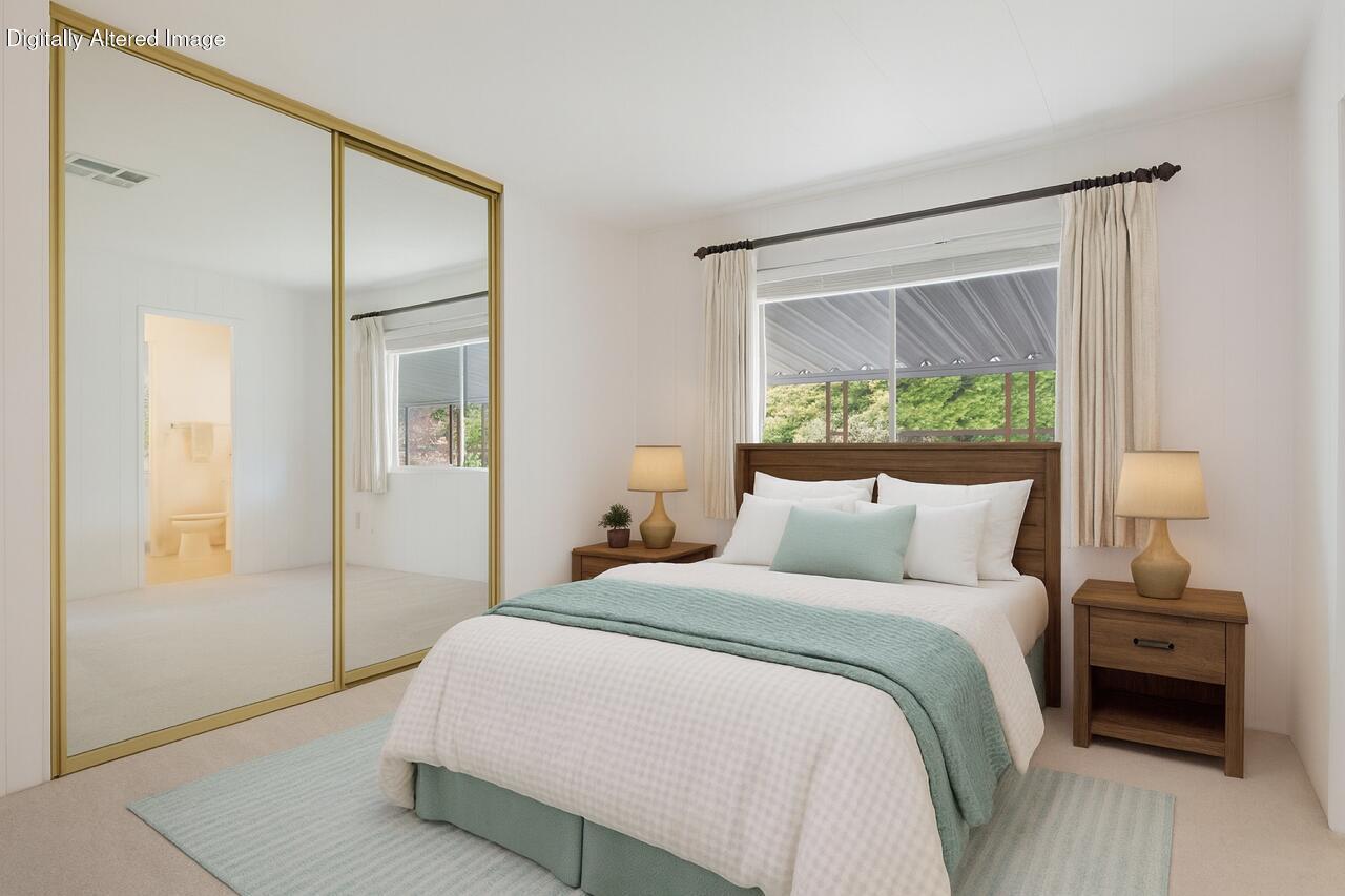 340 Old Mill Road, Unit 127 Santa Barbara, CA 93110 - Photo 17 of 33 a bedroom with a bed and a large mirror