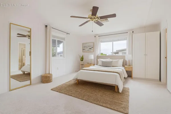 a spacious bedroom with a bed and a walk in closet