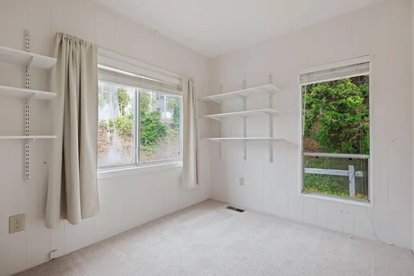 an empty room with windows