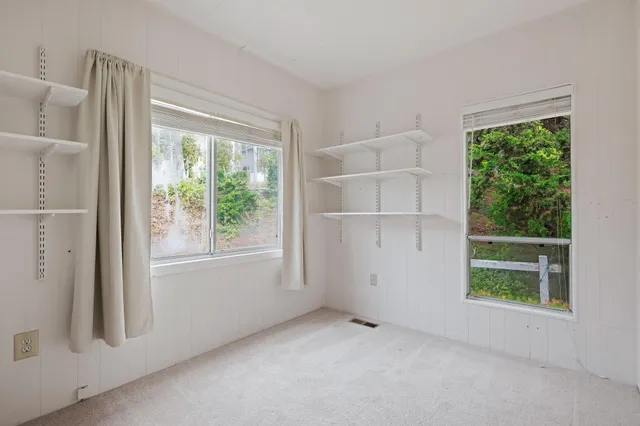 an empty room with windows