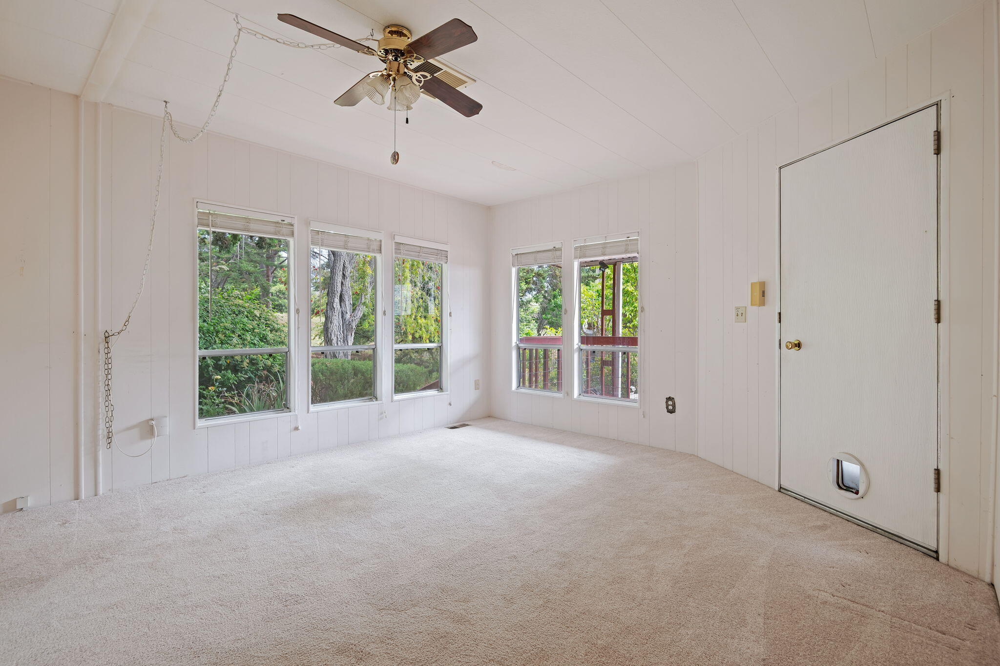 340 Old Mill Road, Unit 127 Santa Barbara, CA 93110 - Photo 7 of 33 a view of a livingroom with a ceiling fan and window