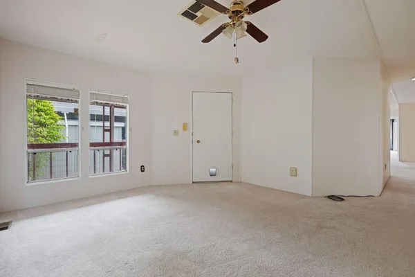a view of an empty room with a window