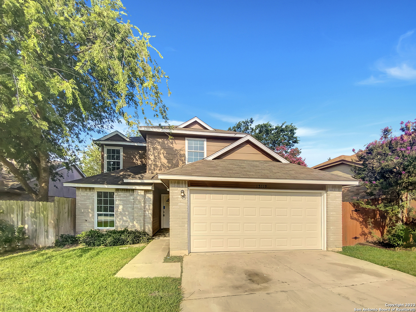 15119 Eagle Run San Antonio, TX 78233 - Photo 1 of 1 a front view of a house with a yard and garage