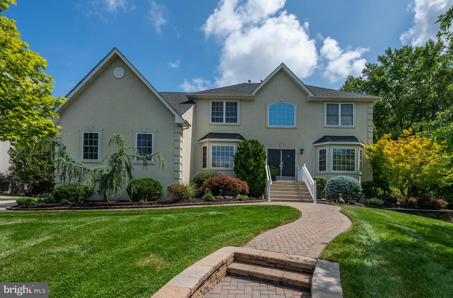 11 Gaskill Road Mount Laurel, NJ 08054 - Photo 1 of 56 a front view of a house with a yard and garage