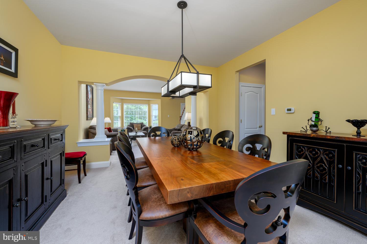 11 Gaskill Road Mount Laurel, NJ 08054 - Photo 16 of 56 a view of a dining room and livingroom with furniture wooden floor a chandelier