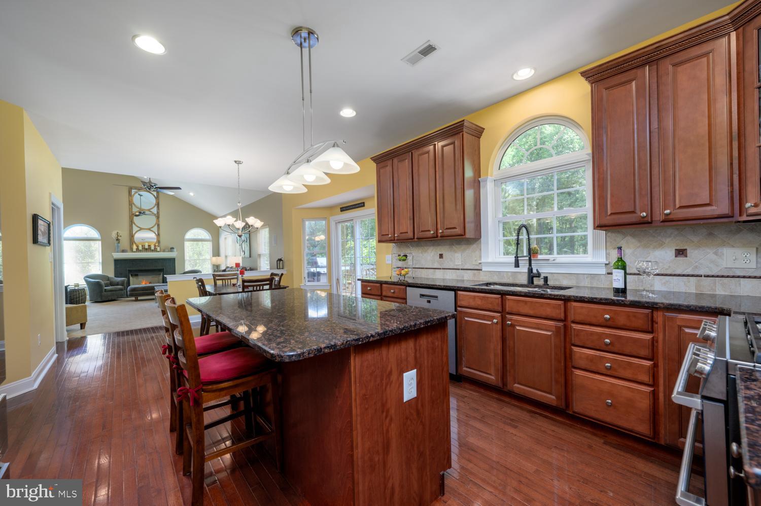 11 Gaskill Road Mount Laurel, NJ 08054 - Photo 17 of 56 a kitchen with stainless steel appliances granite countertop a sink a stove a dining table and chairs
