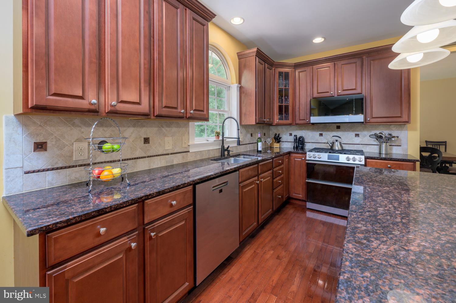 11 Gaskill Road Mount Laurel, NJ 08054 - Photo 19 of 56 a kitchen with stainless steel appliances granite countertop wooden cabinets a sink and dishwasher