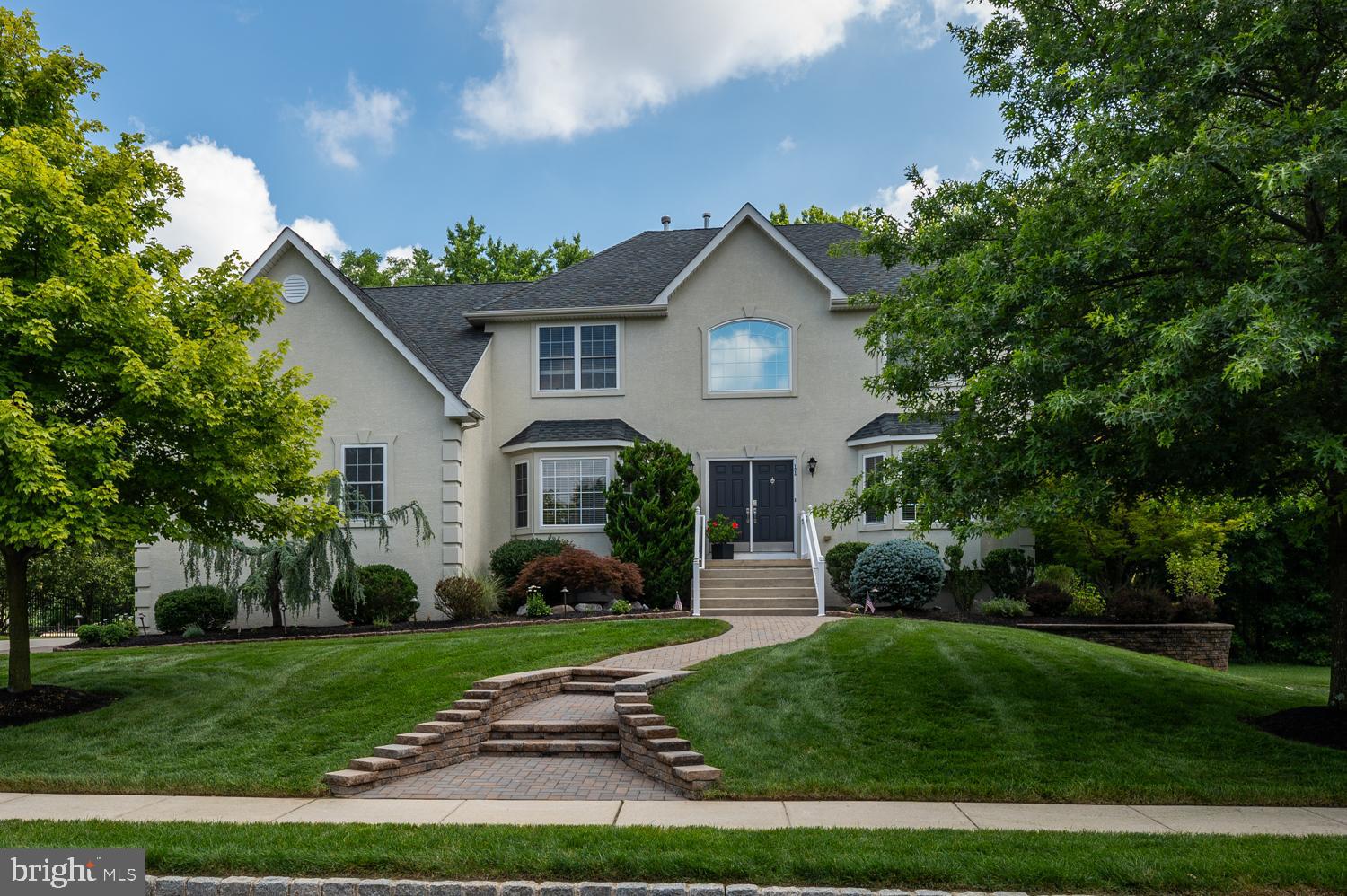 11 Gaskill Road Mount Laurel, NJ 08054 - Photo 2 of 56 a front view of a house with a garden and plants